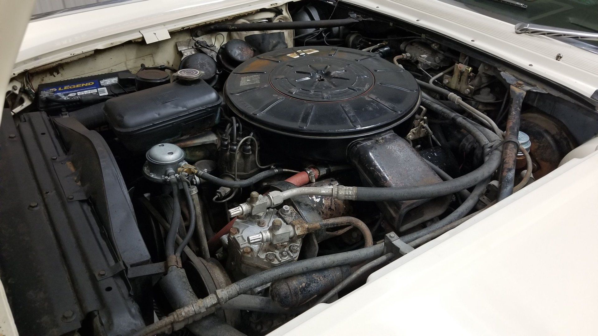 Deciphering The Build Sheets Of A 1960s Ford Thunderbird And Lincoln Continental 9 Engine compartment picture of 430-cubic-inch Lincoln engine in white 1963 Lincoln Continental