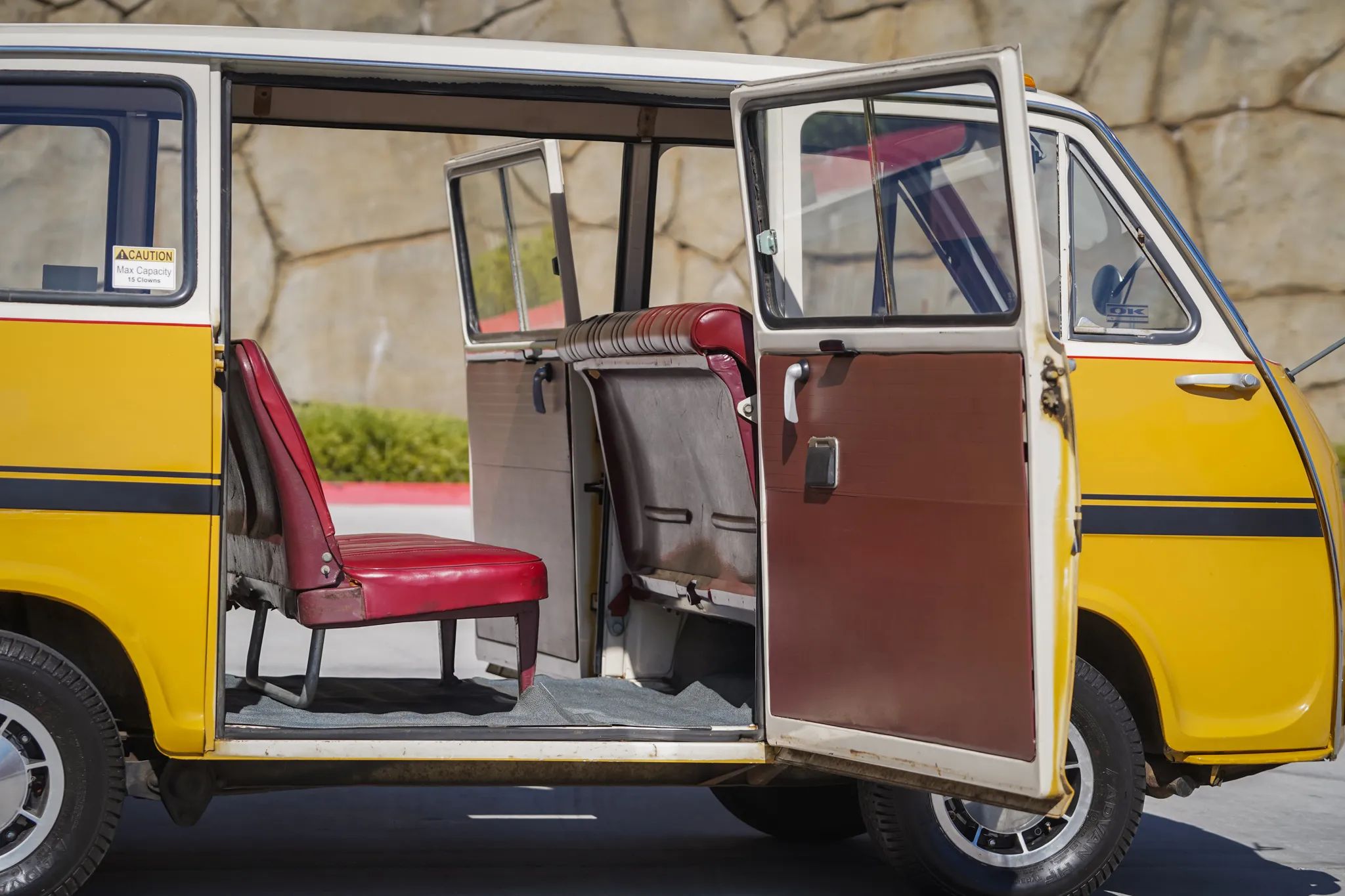Subaru Sambar keitora van with both side doors open to reveal the center bench seat, upholstered in red vinyl