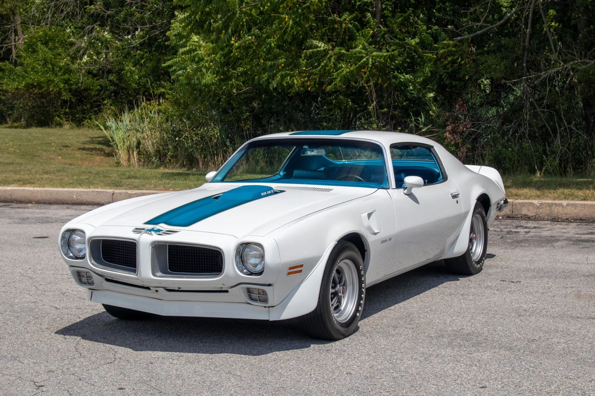 1981 Pontiac Firebird Trans Am: The Four-Speed Option Prepared Buyers For A Chevy-Powered Future 2 Driver's side front three-quarter view of white and blue 1970 1/2 Trans Am