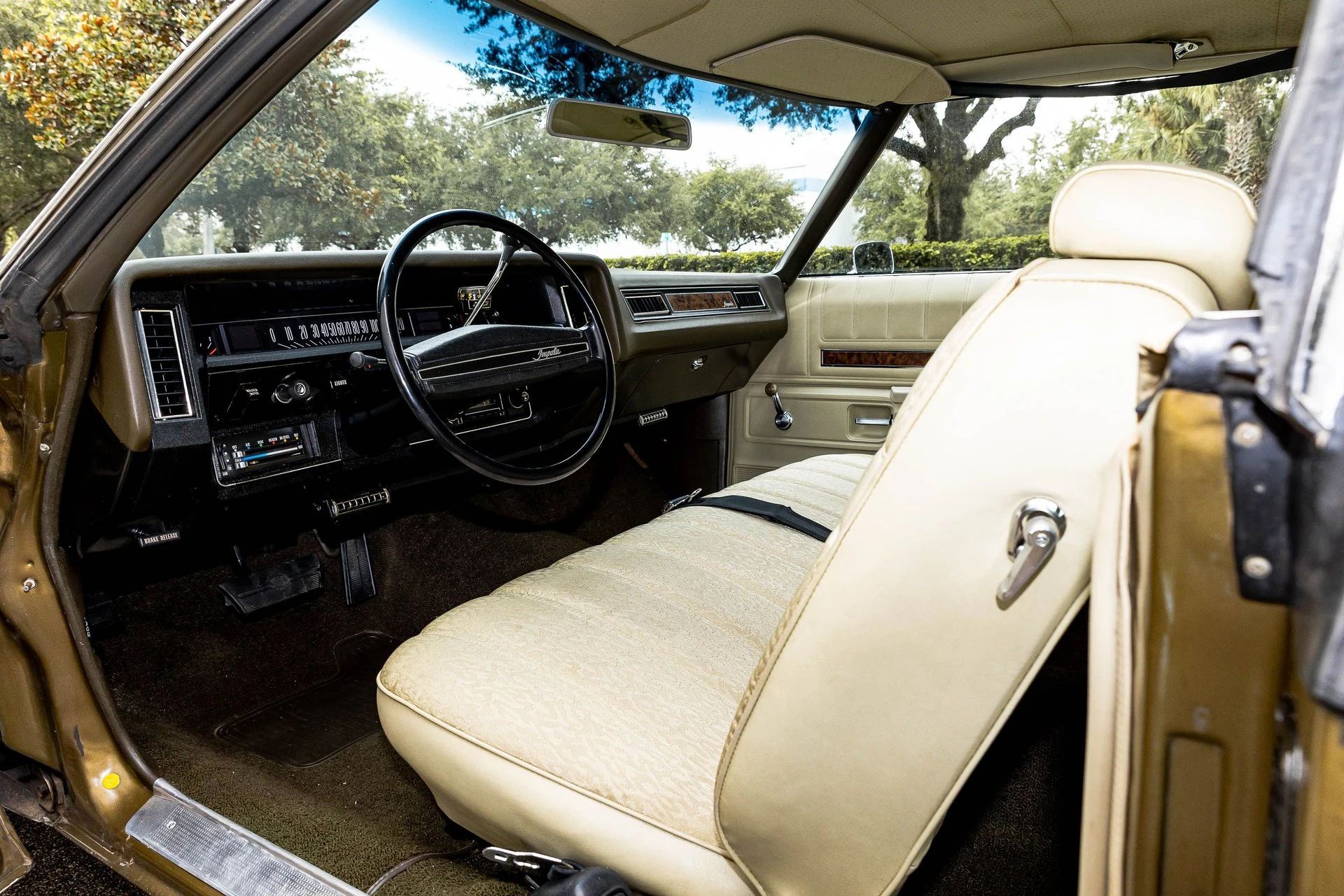Left side of the dashboard and front seat of a 1972 Chevrolet