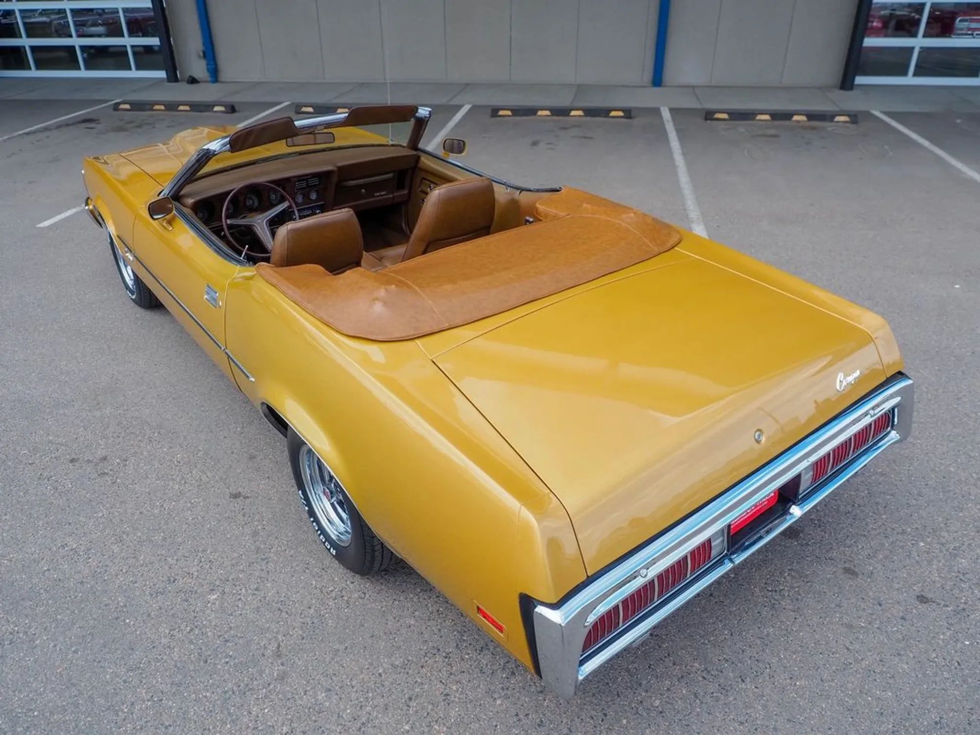 1973 Mercury Cougar XR-7 Convertible: Still A Mustang Underneath, With Q-Code 351 And Rare 4-Speed 7 High-angle left rear 3q view of a 1973 Cougar convertible with the top down