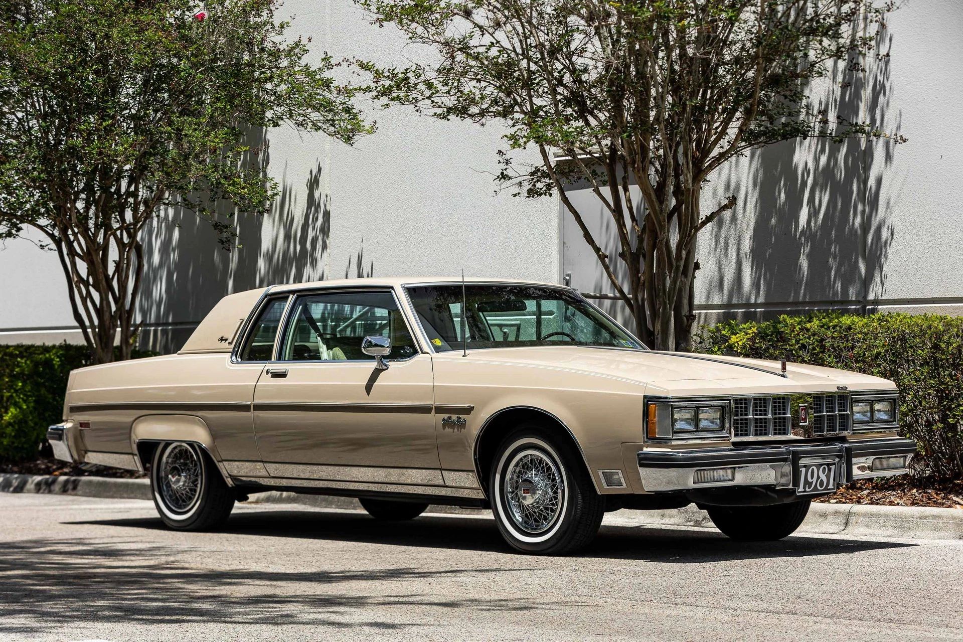 Right front 3q view of a Sandstone Beige Oldsmobile Ninety-Eight Regency Coupe