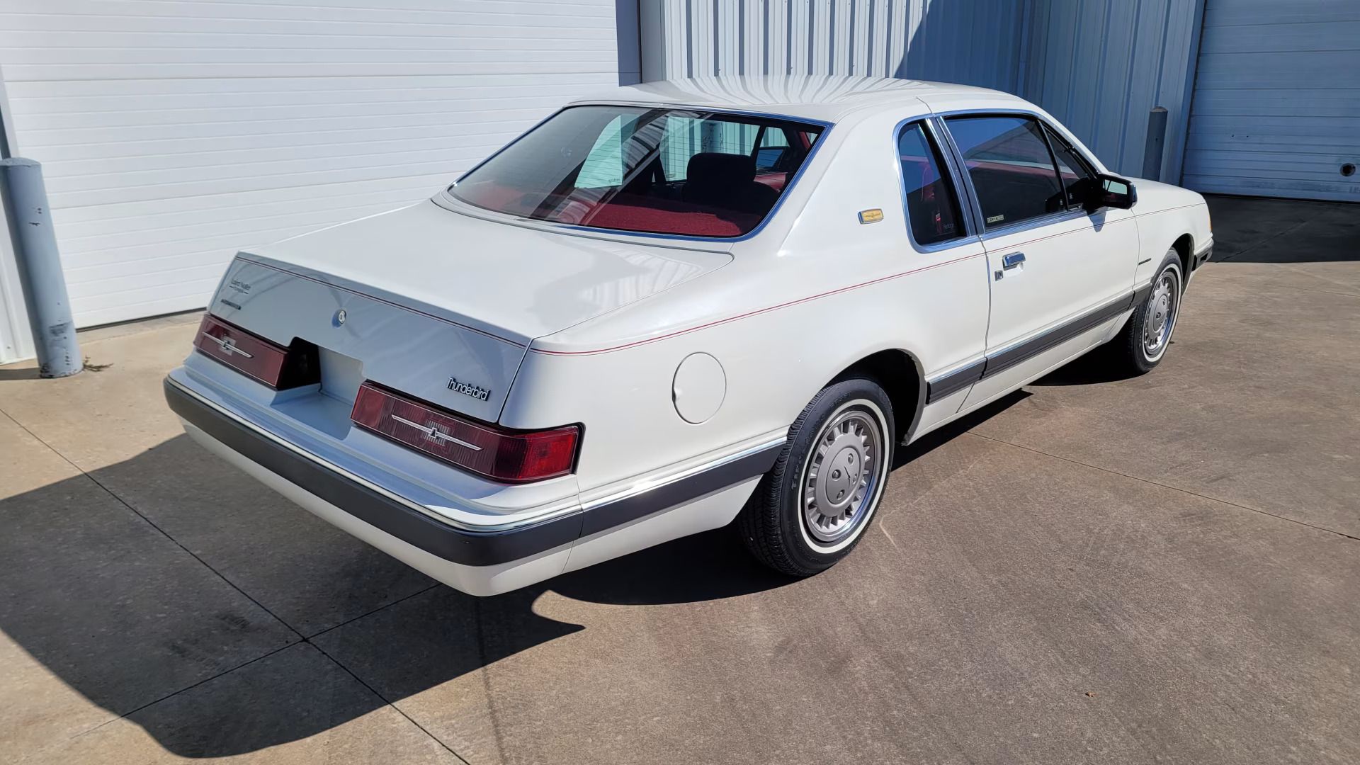 1983 Buick LeSabre Vs. 1983 Ford Thunderbird: My Family Chooses Between The Brougham Look And The Aero Bird 3 Passenger rear three-quarter image of white 1983 Ford Thunderbird Heritage