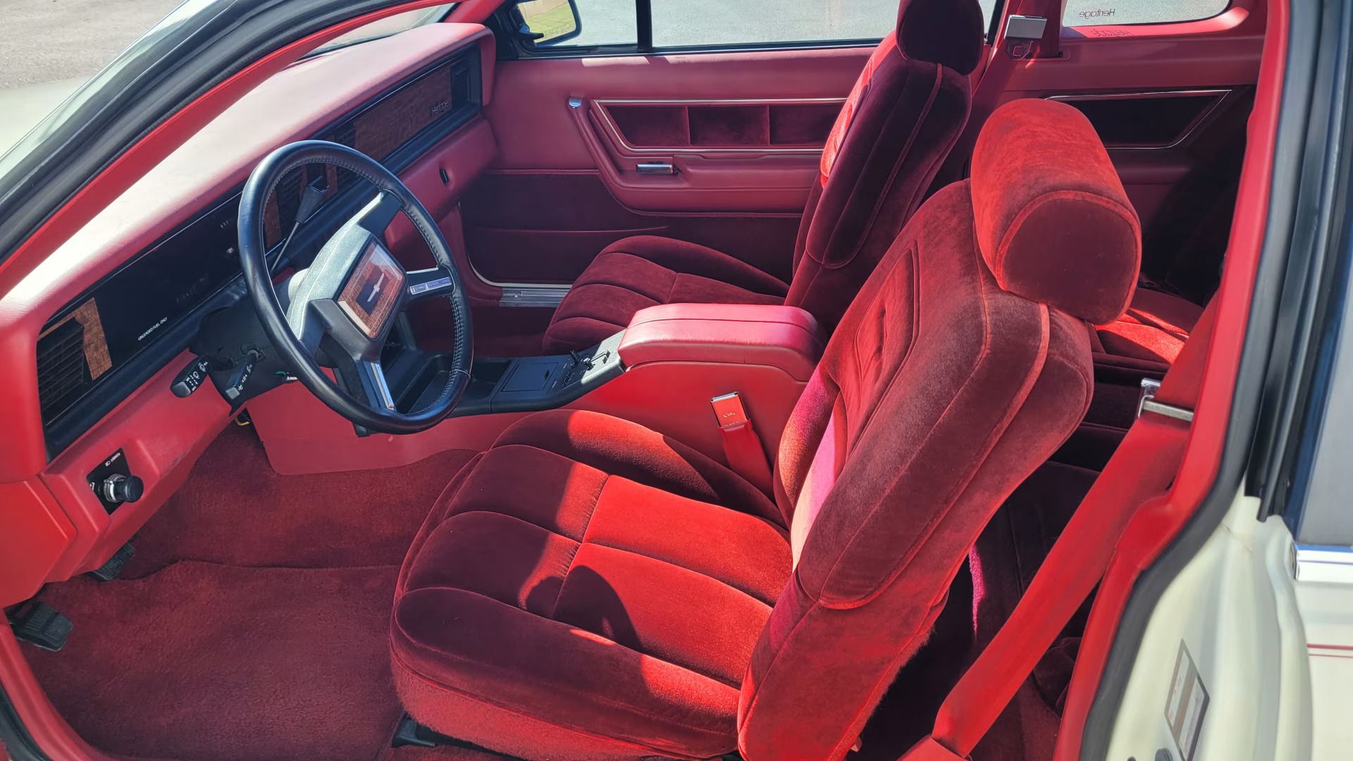 1983 Buick LeSabre Vs. 1983 Ford Thunderbird: My Family Chooses Between The Brougham Look And The Aero Bird 4 Image of red interior of 1983 Ford Thunderbird Heritage
