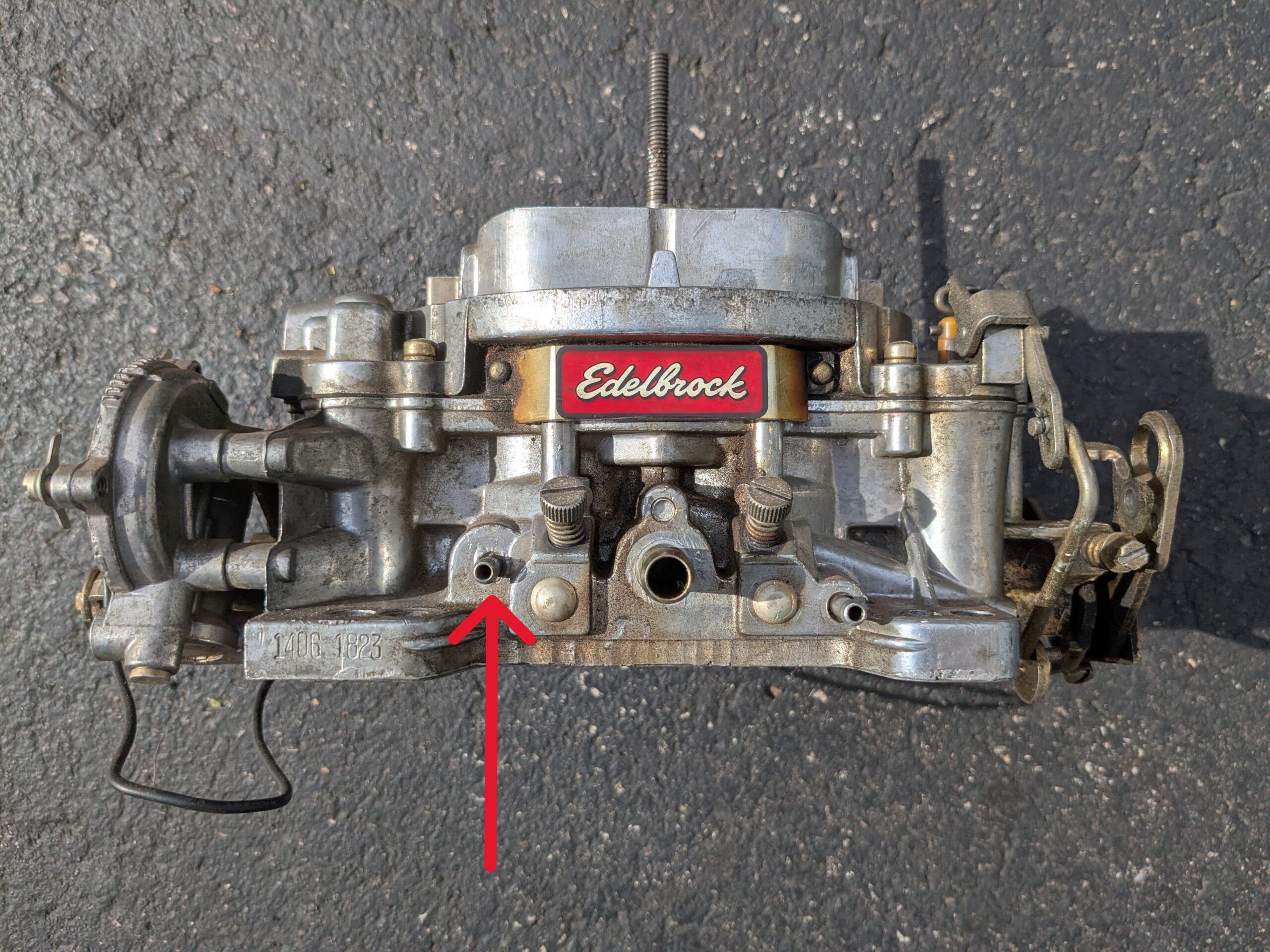 Image of the vacuum advance ports on an Edelbrock four-barrel carburetor