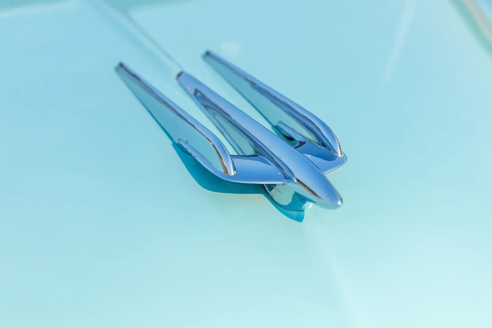 1949 Oldsmobile Rocket V-8 And The Ultra-High-Compression Economy Version That Never Made It 20 Rocket hood ornament on a Crest Blue 1949 Oldsmobile 98