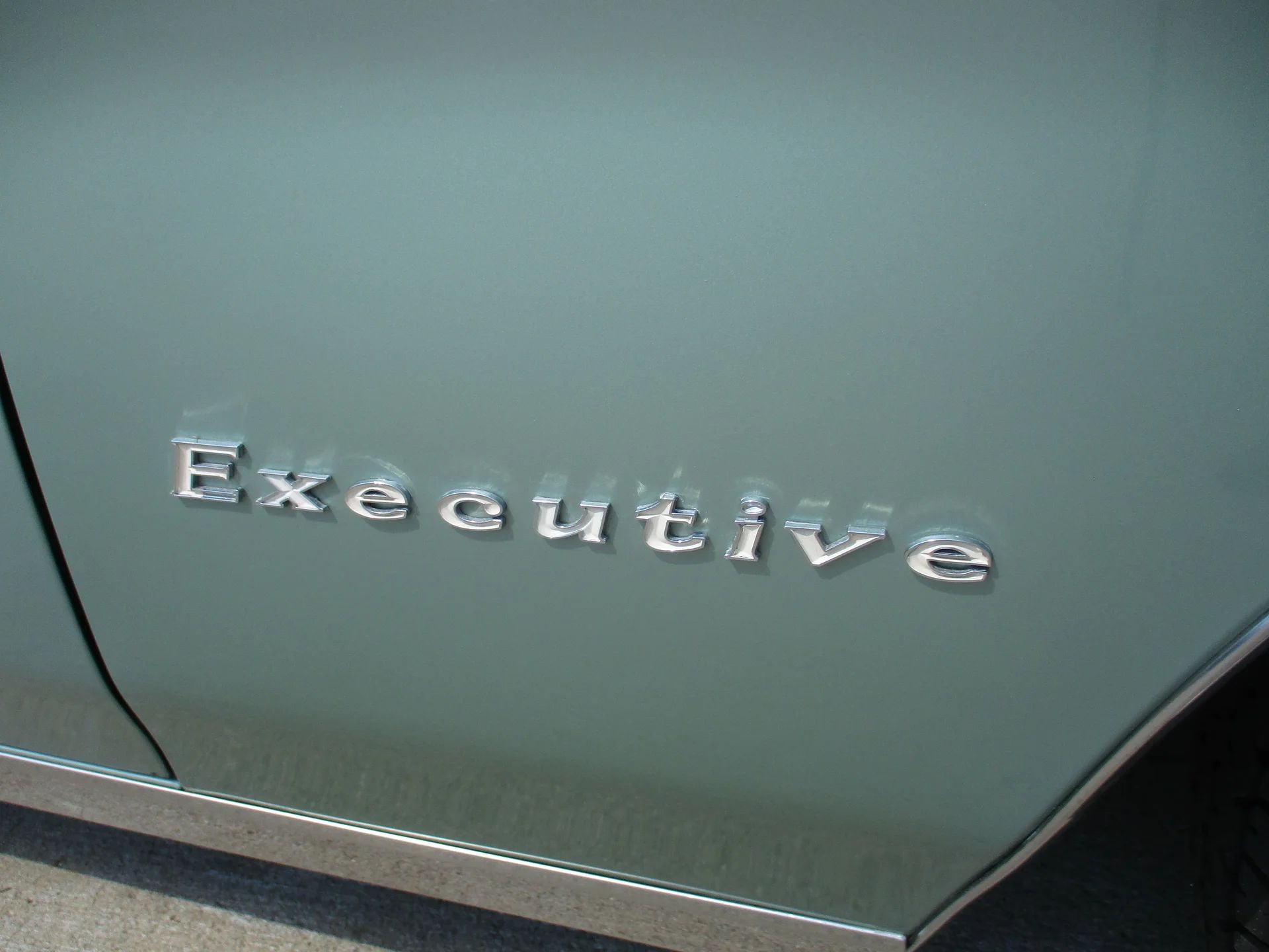 1967 Pontiac Executive Hardtop Coupe: The Star Chief Gets A Promotion 2 Close up of "EXECUTIVE" badge on the fender of a 1967 Pontiac