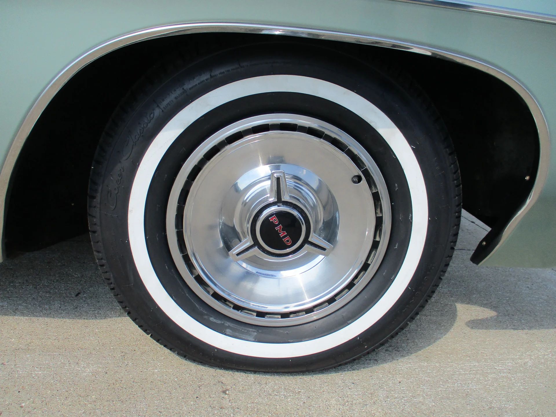 1967 Pontiac Executive Hardtop Coupe: The Star Chief Gets A Promotion 12 Wheel cover and whitewall tire on a green car