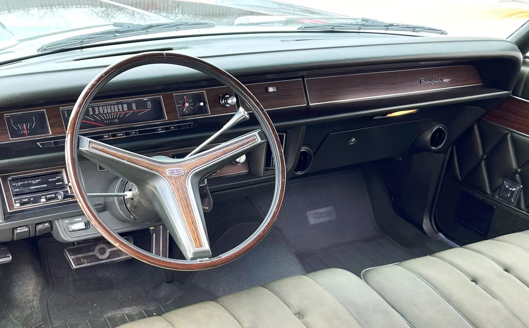 1970 Mercury Marquis Brougham Four-Door Hardtop: The Budget Continental 12 Dashboard of a 1970 Mercury Marquis, seen from the back seat looking over the front seat