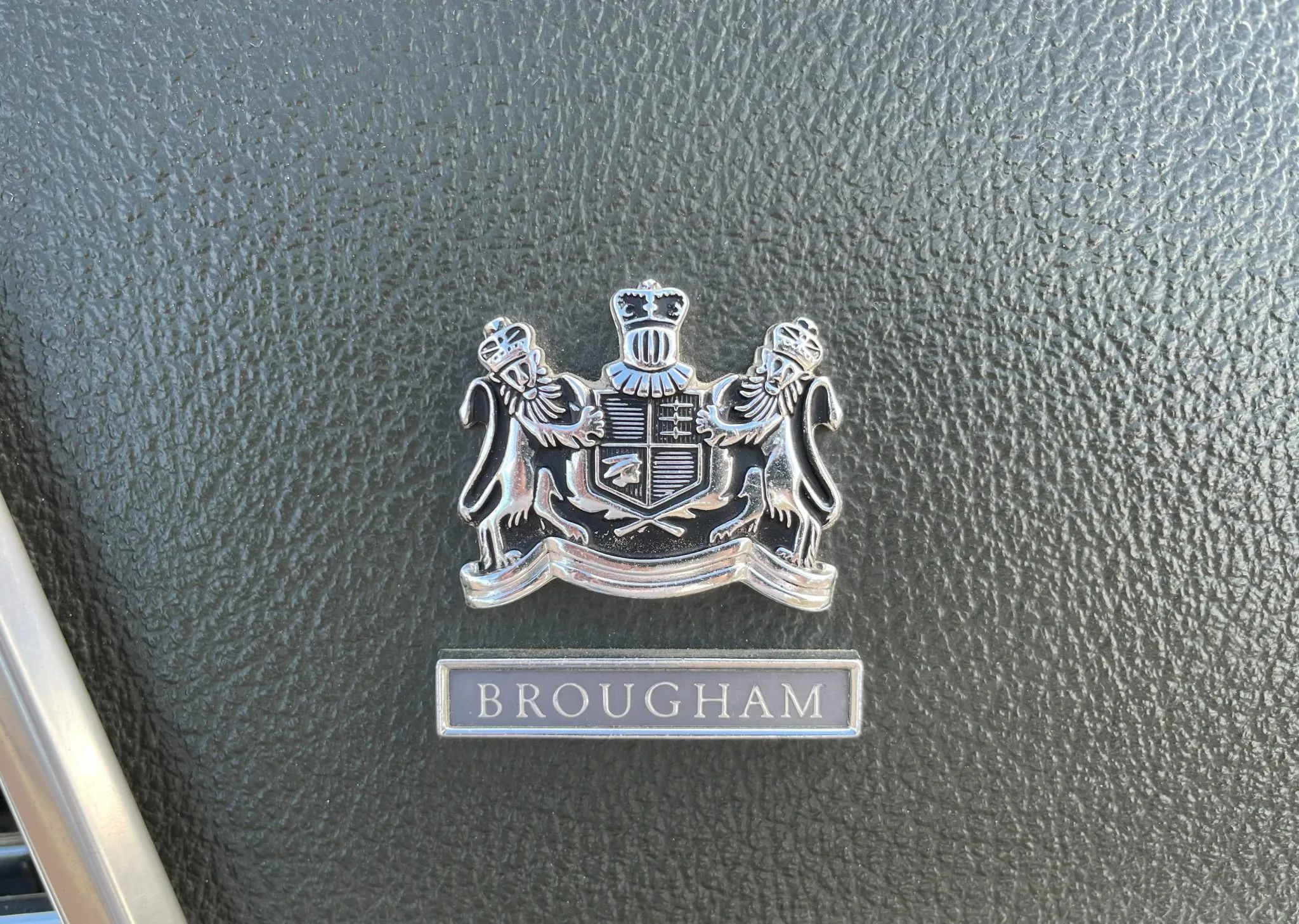 1970 Mercury Marquis Brougham Four-Door Hardtop: The Budget Continental 21 Brougham badge on the sail panel of a 1970 Mercury Marquis