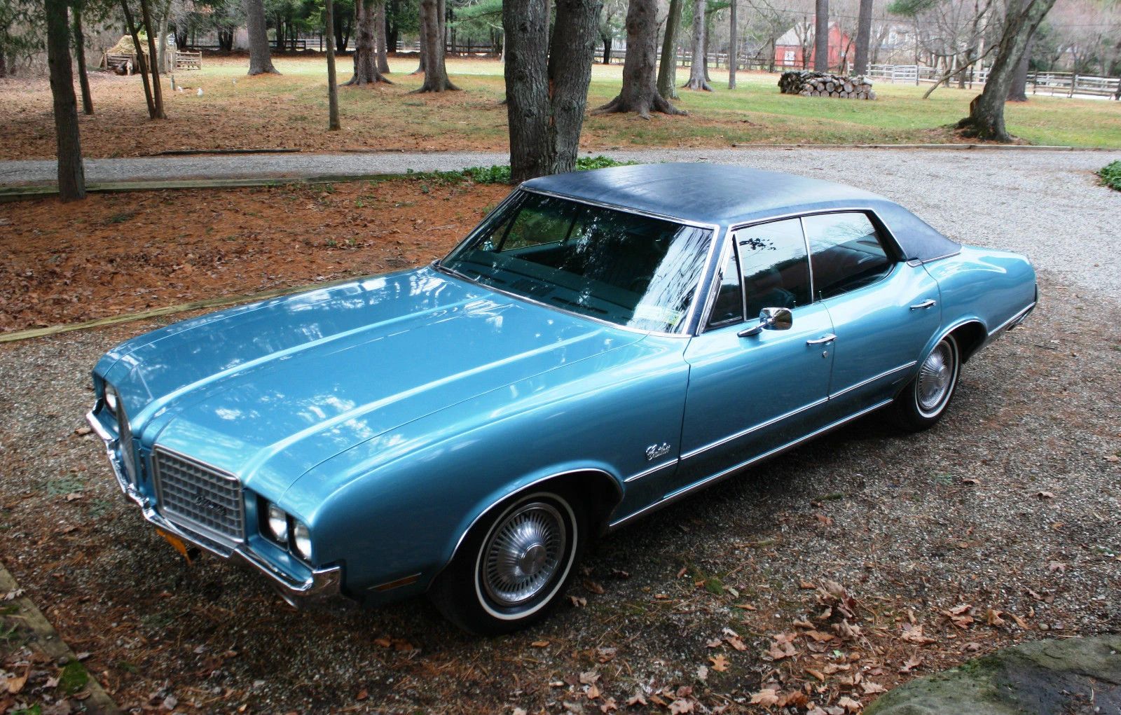 1972 Pontiac Luxury LeMans: The Rise And Fall Of The Midsize Four-Door Hardtop 19 High-angle left front 3q view of a 1972 Oldsmobile four-door hardtop in a wooded area