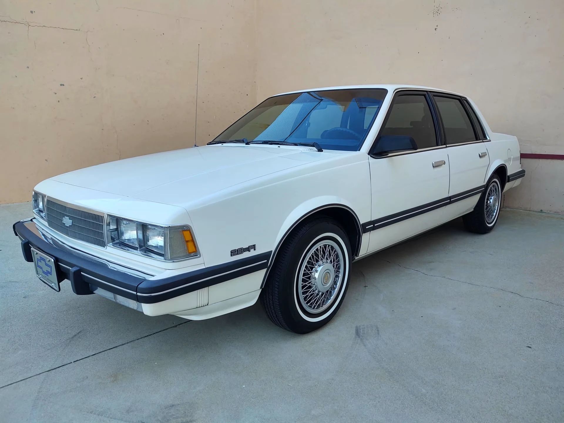 Left front 3q view of a white 1986 Chevrolet Celebrity CL four-door sedan