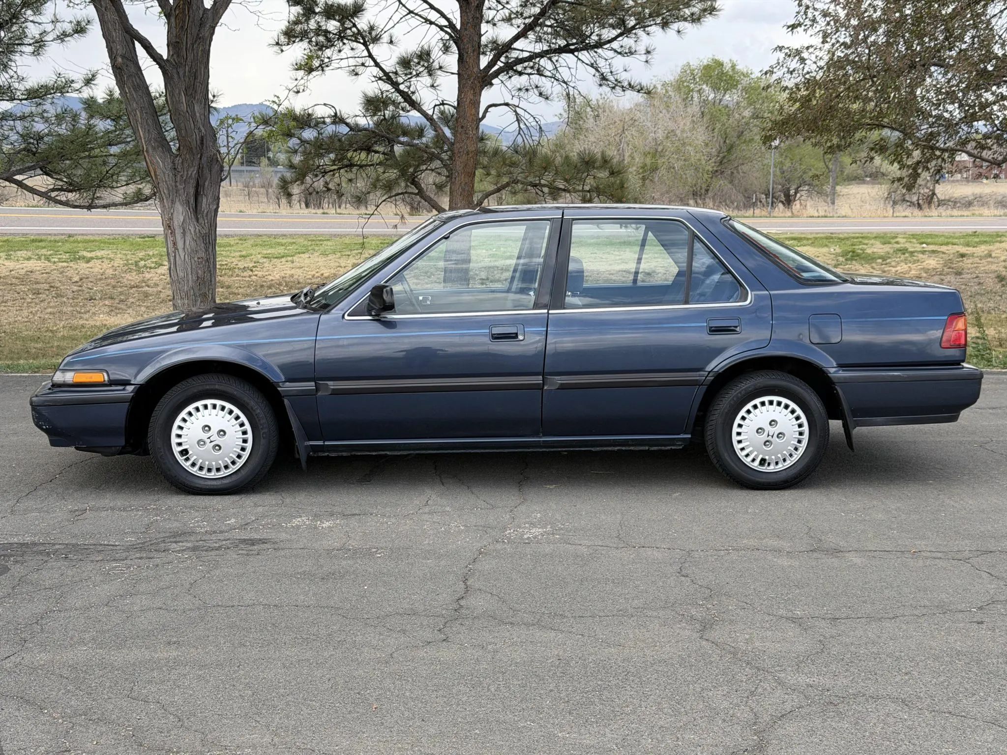 Left side view of a Florence Blue 1988 Honda Accord LX four-door sedan