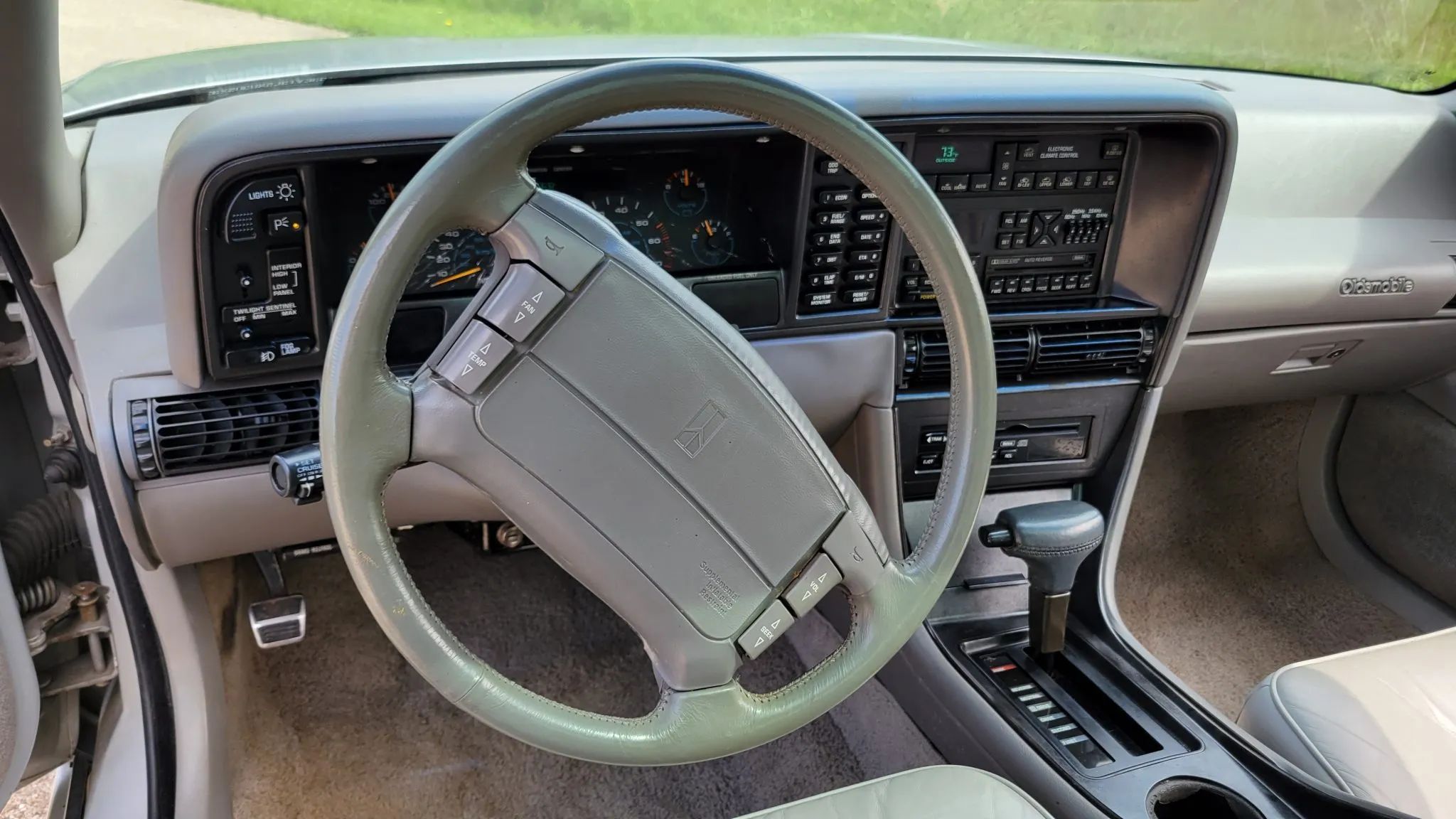 Steering wheel and dashboard of a 1992 Oldsmobile Troféo