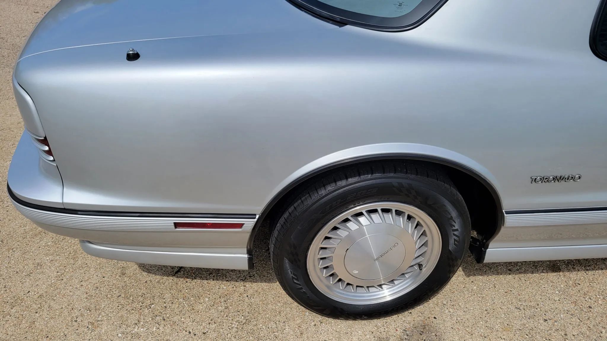 Closeup of the right side of the tail of a 1992 Oldsmobile Toronado