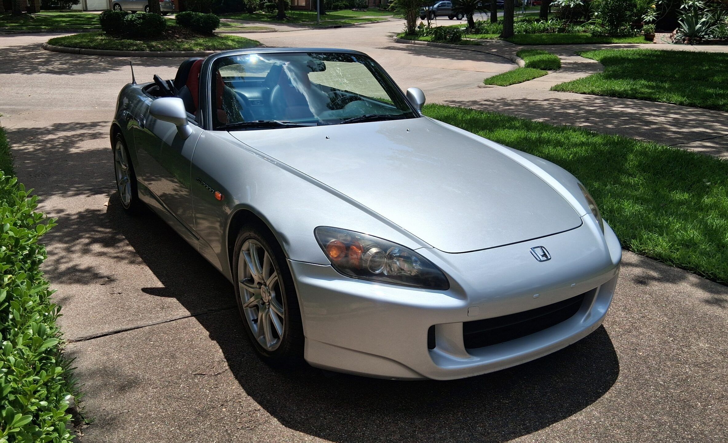 2005 Honda S2000 Driving Impressions: Honda’s RWD Roadster Produces Big Grins 1 Photo of a silver 2005 Honda S2000 roadster with the top down