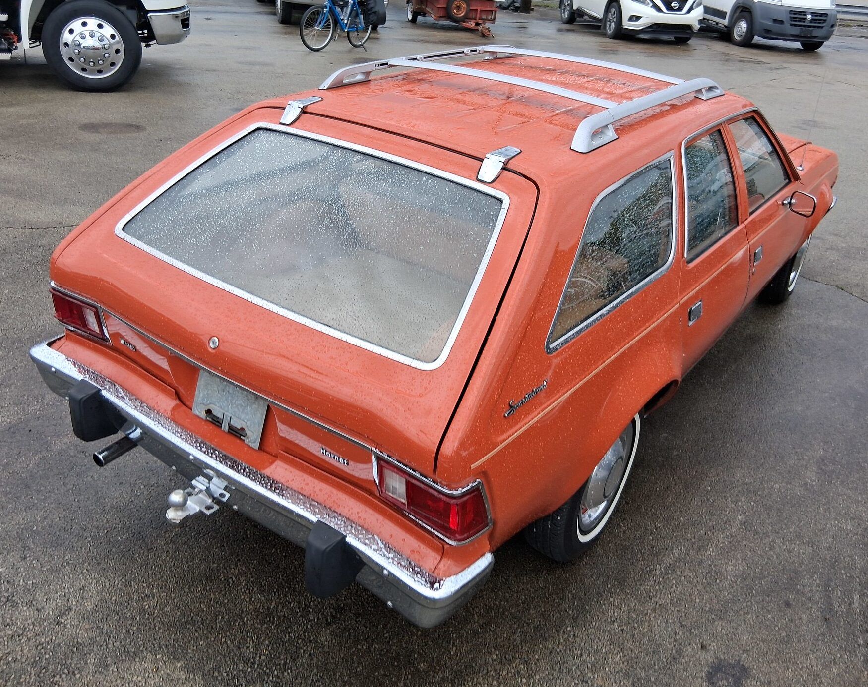 Passenger rear three-quarter view of orange AMC Hornet Sportabout
