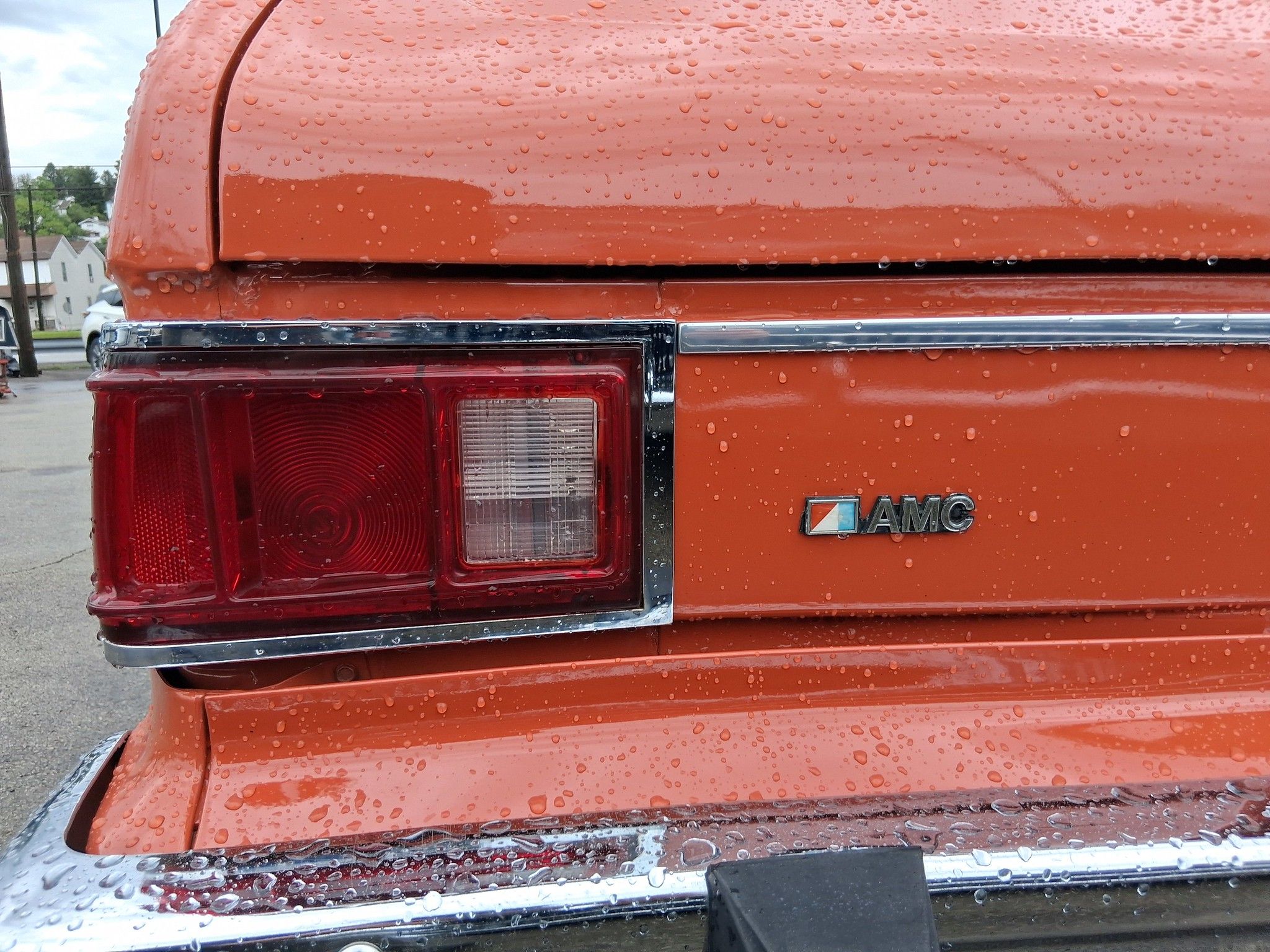 Left rear taillight of orange AMC Hornet Sportabout