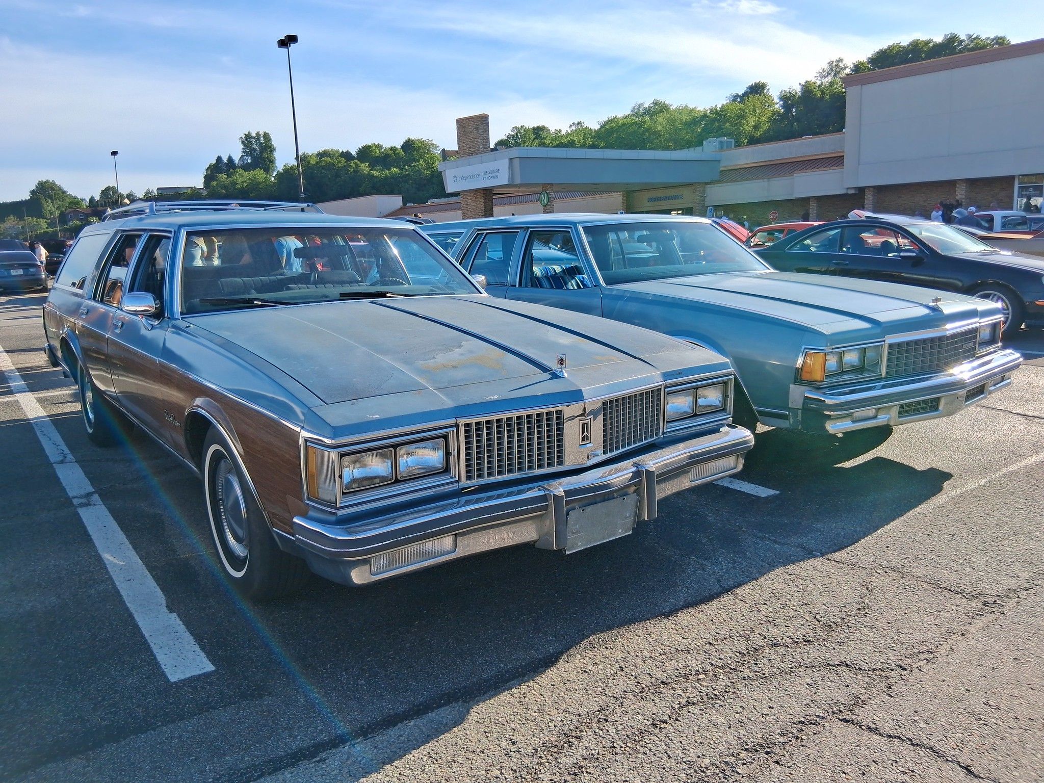 Picture of blue Oldsmobile Custom Cruiser and Chevrolet Caprice Wagons