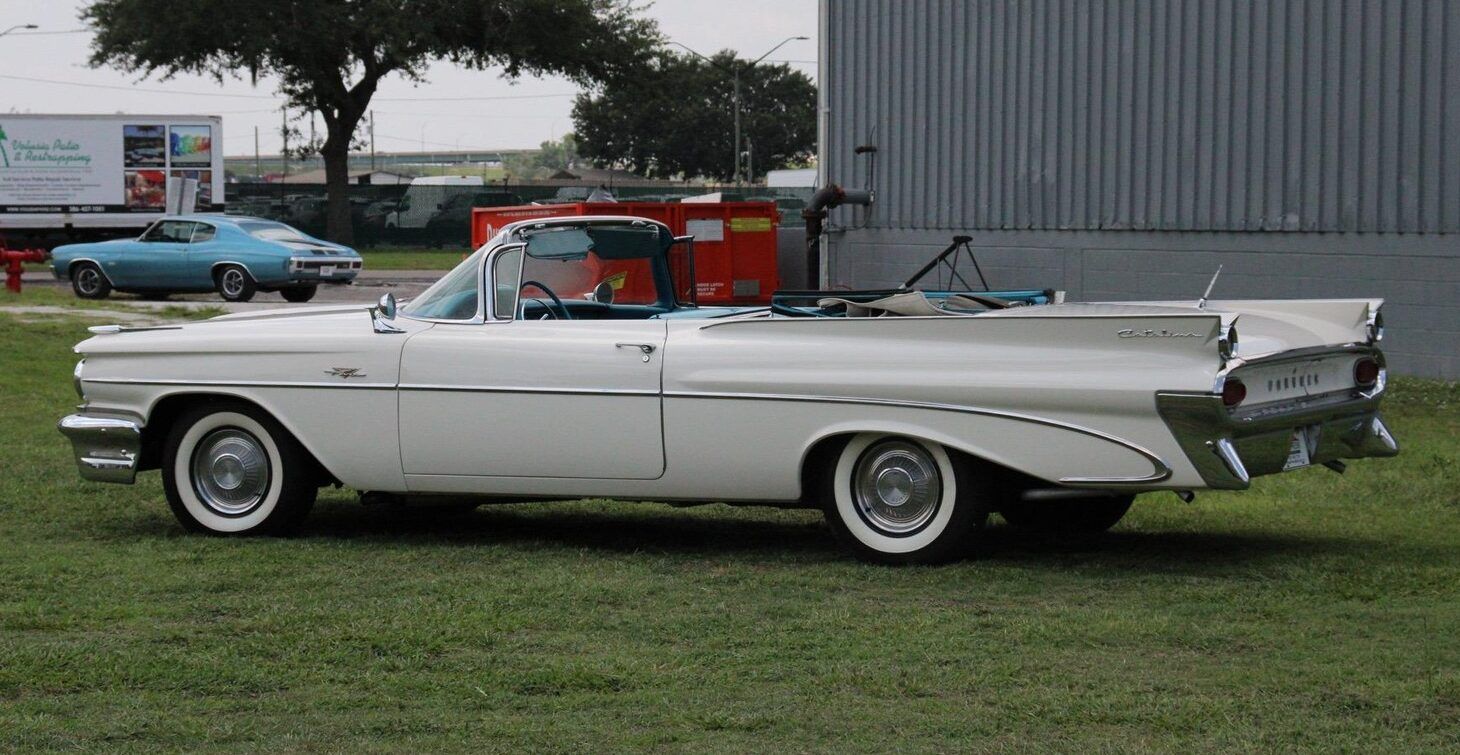 Driver rear three-quarter image of white 1959 Pontiac Catalina Convertible