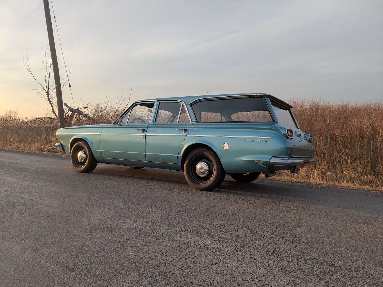 Profile view of turquoise 1965 Dodge Dart station wagon