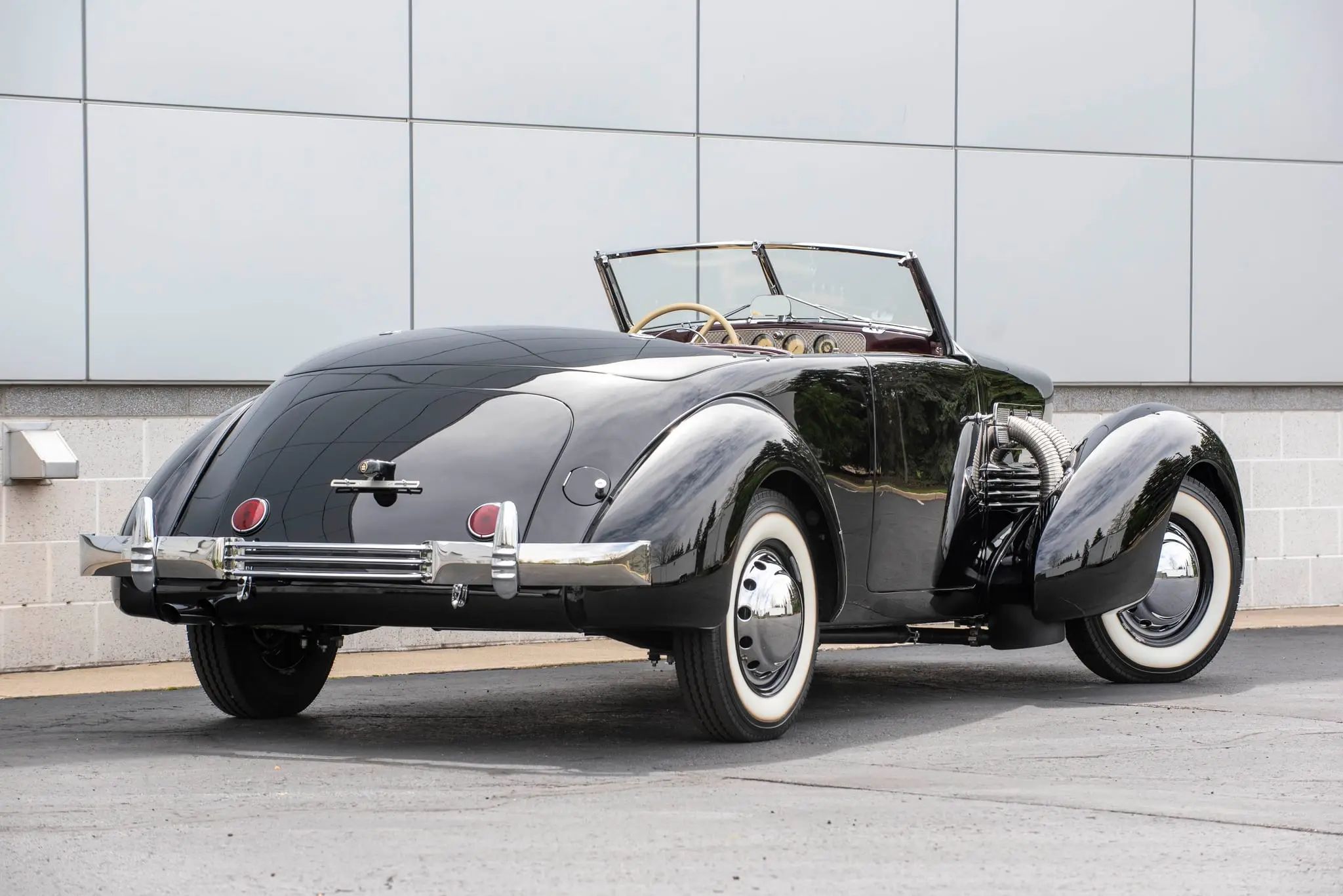Passenger rear three-quarter view of 1937 Cord 812 Phaeton