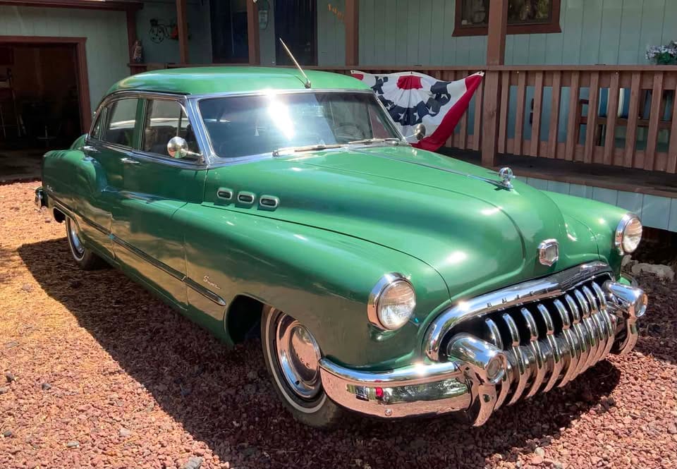 Passenger front three-quarter view of green 1950 Buick Super Sedan