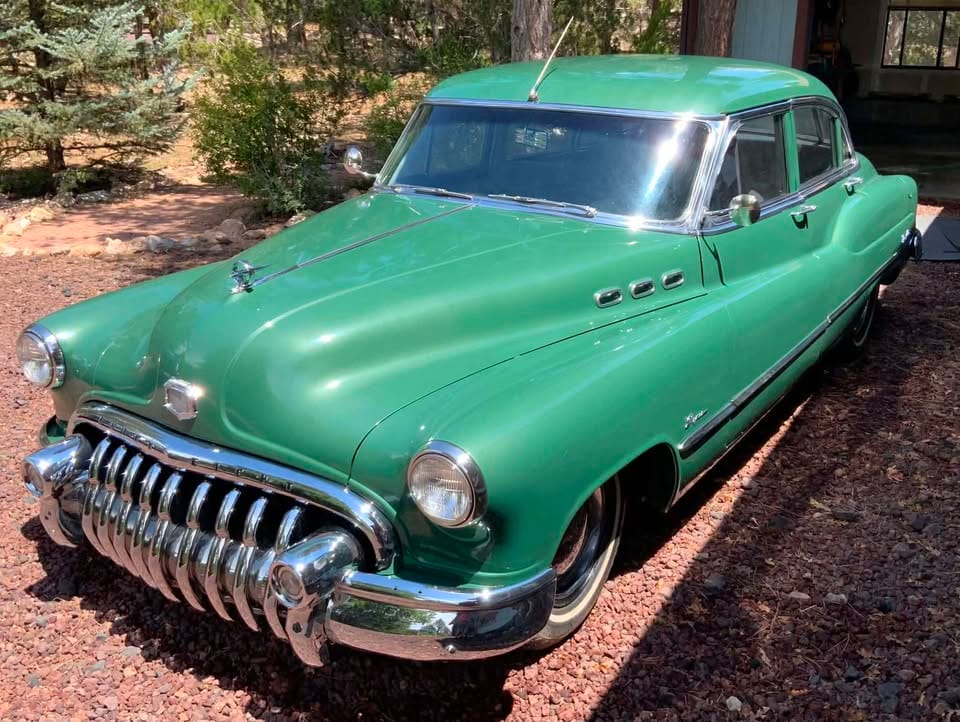 Driver front three-quarter view of green 1950 Buick Super Sedan