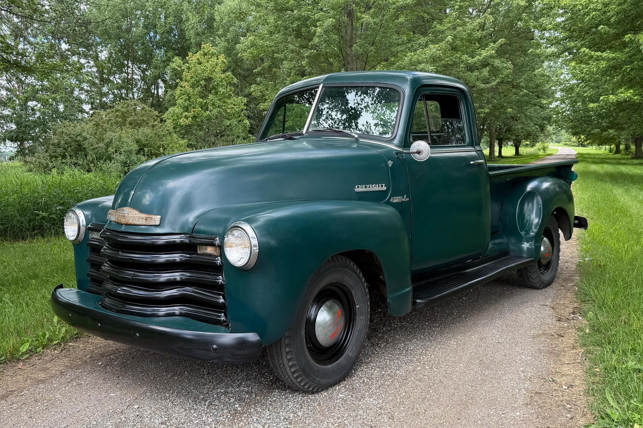 Driver front three-quarter image of green 1953 Chevy truck for sale