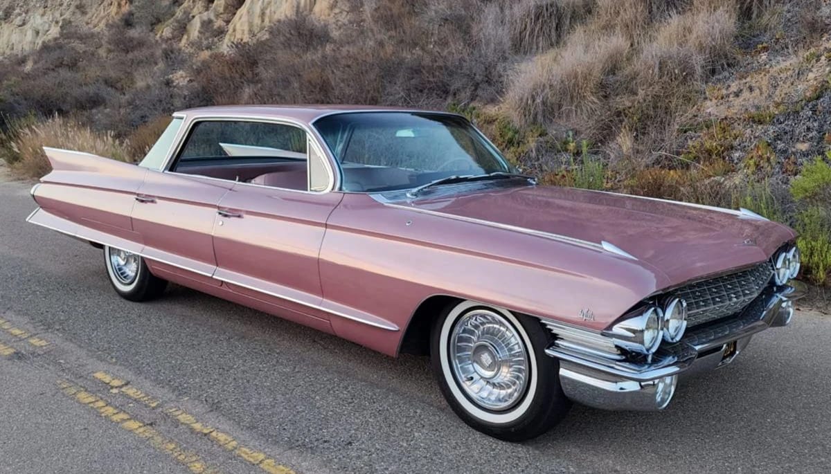 Right front 3q view of a 1961 Cadillac 4-window Sedan de Ville four-door hardtop in metallic Fontana Rose