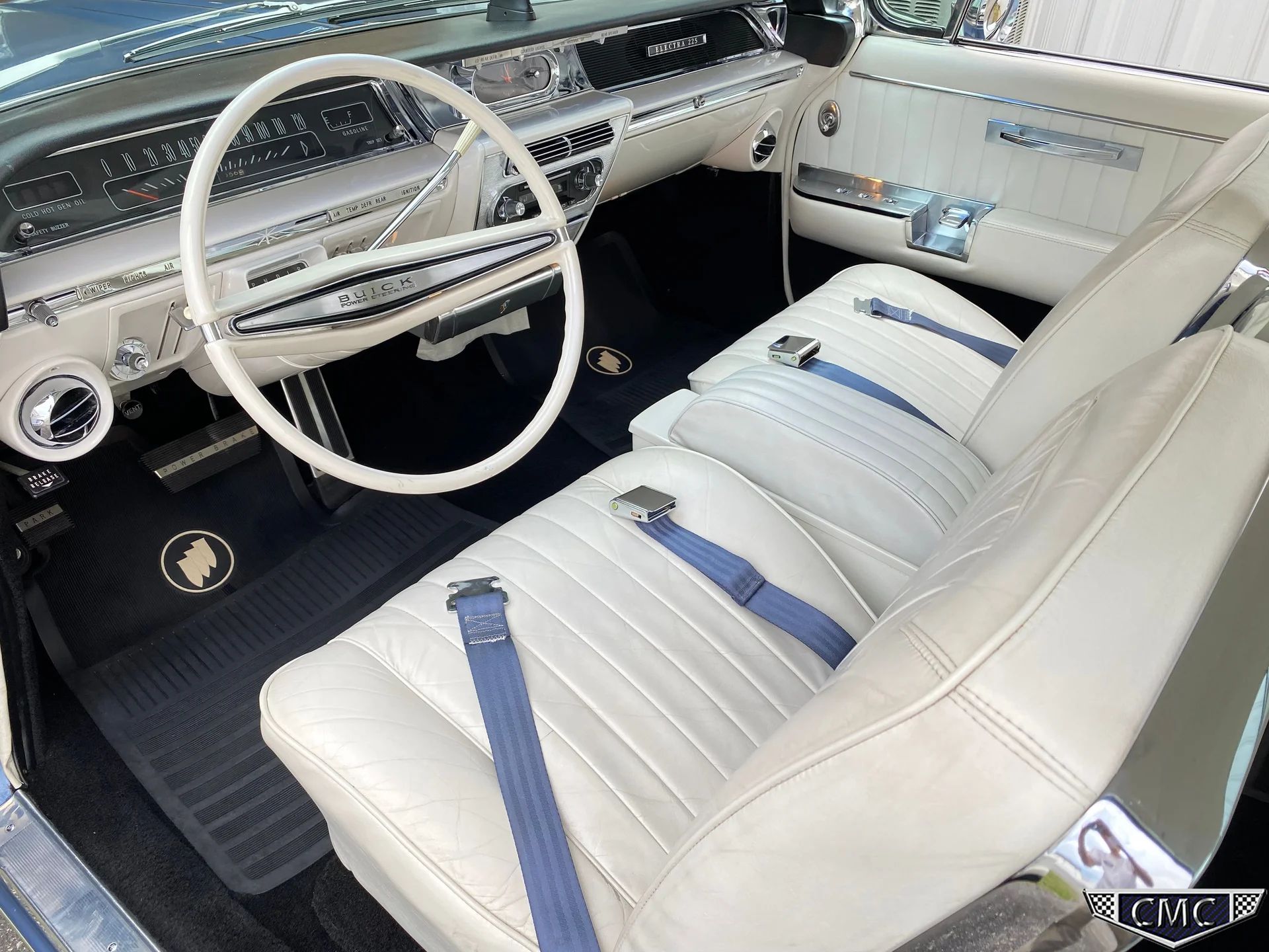 Dashboard and front seats of a 1962 Buick