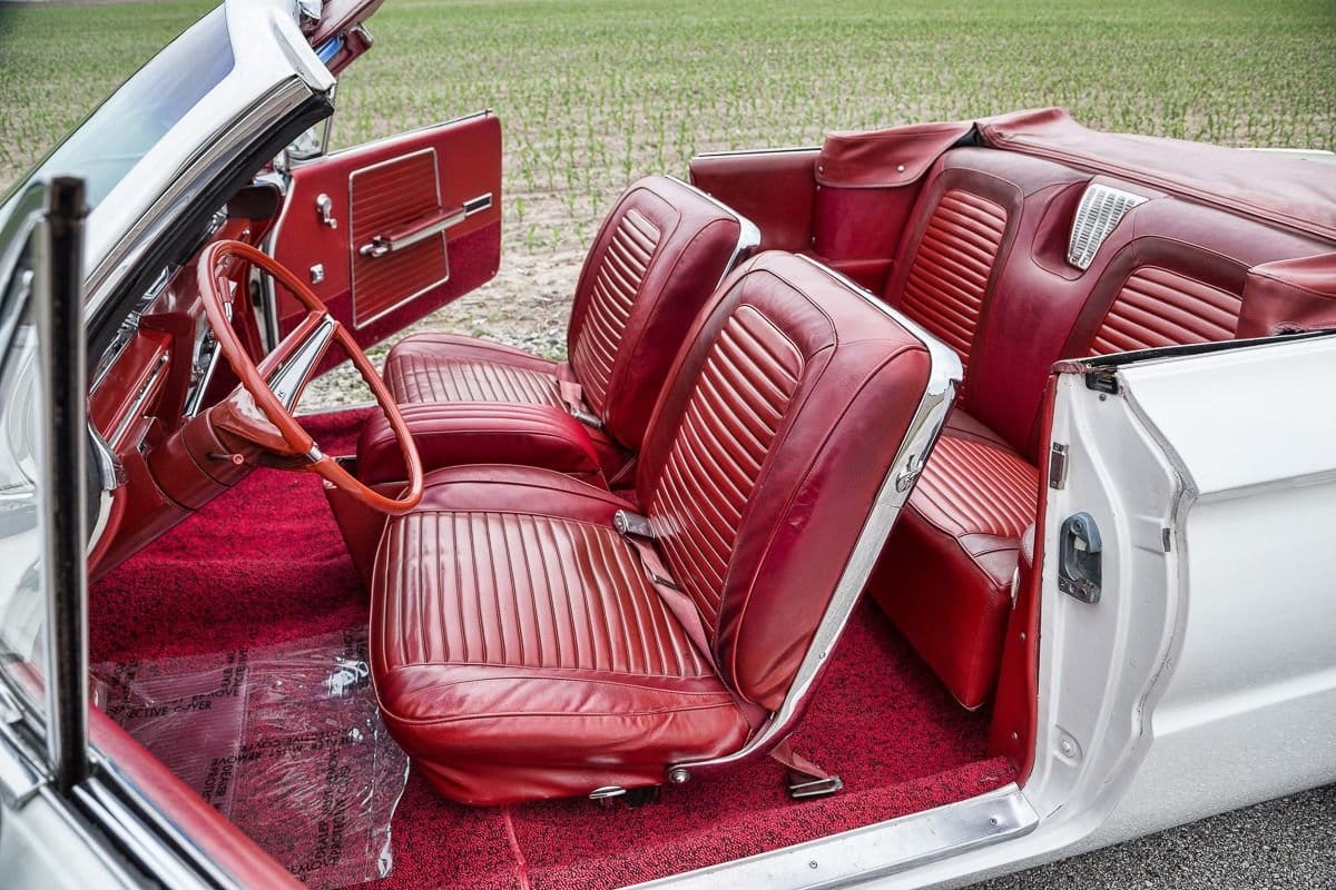 Front bucket seats of a white 1962 Buick Invicta convertible