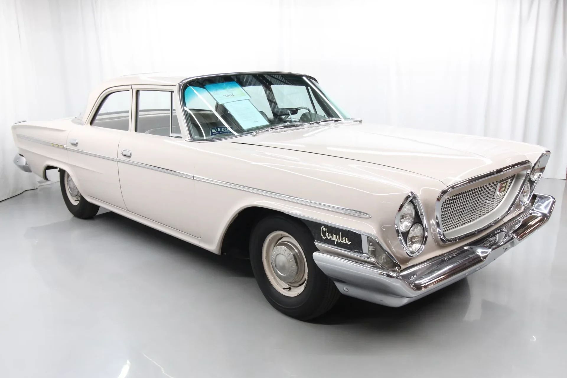 1962 Chrysler Newport 3-Speed Four-Door Sedan: Basic Big Car With An Upscale Badge And Not Much Else 3 Right front 3q view of a 1962 Chrysler sedan in an indoor studio space