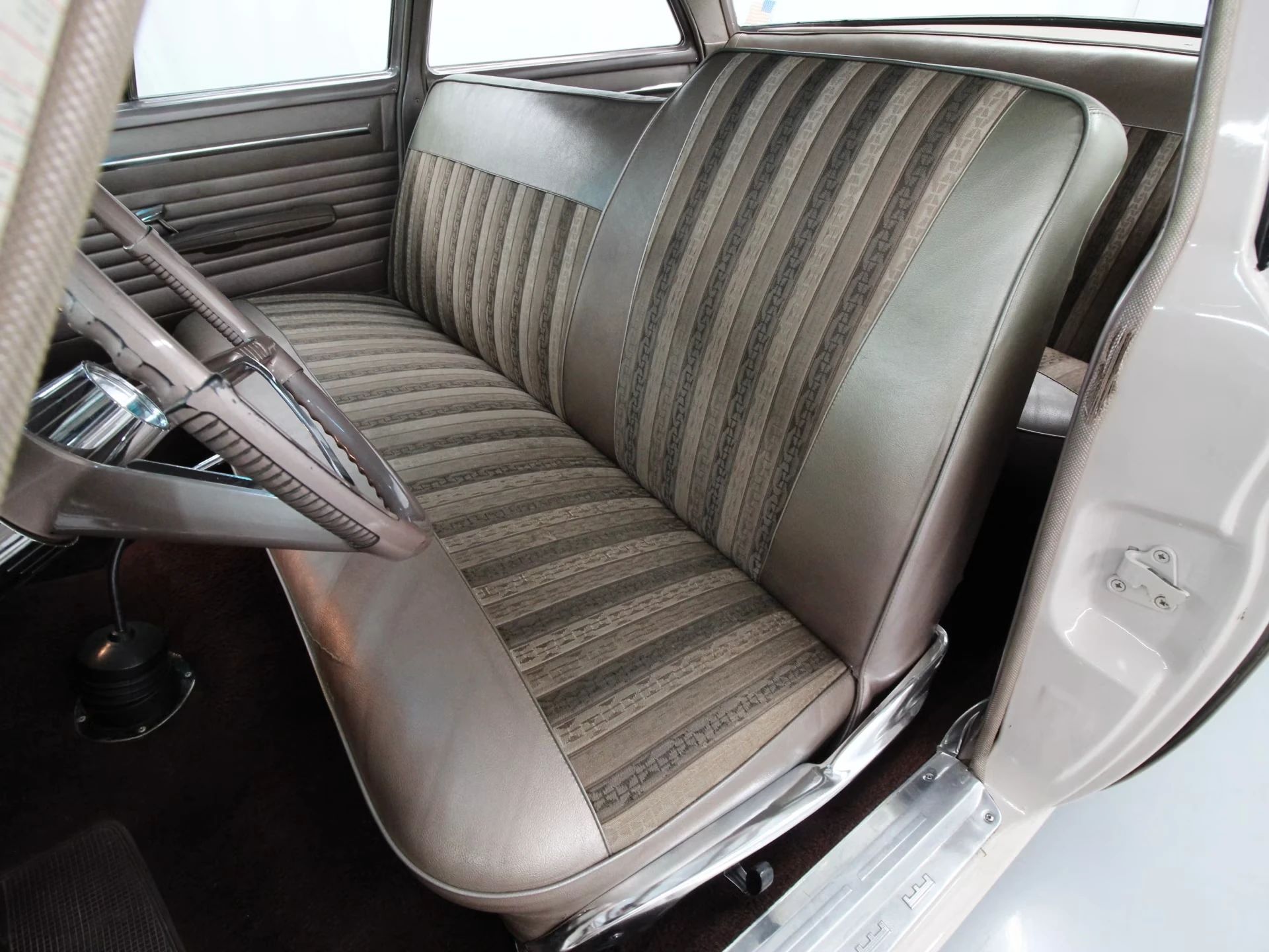 1962 Chrysler Newport 3-Speed Four-Door Sedan: Basic Big Car With An Upscale Badge And Not Much Else 15 Front seat of a 1962 Chrysler, showing that the driver's side seatback is higher than the passenger side