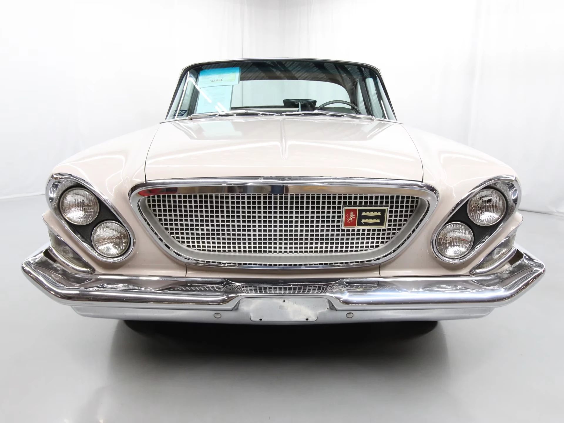1962 Chrysler Newport 3-Speed Four-Door Sedan: Basic Big Car With An Upscale Badge And Not Much Else 22 Front view of a 1962 Chrysler in an indoor studio space