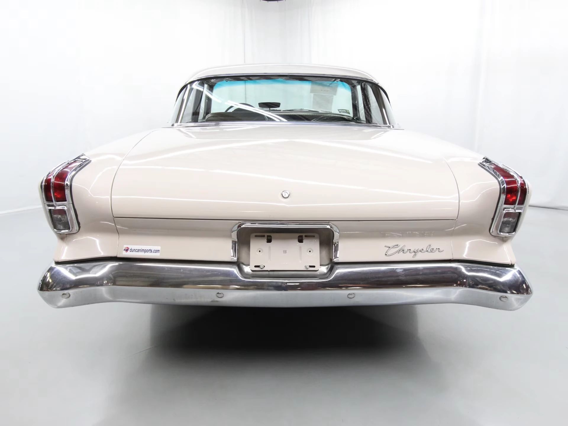 1962 Chrysler Newport 3-Speed Four-Door Sedan: Basic Big Car With An Upscale Badge And Not Much Else 12 Rear view of a 1962 Chrysler four-door sedan in an interior studio space