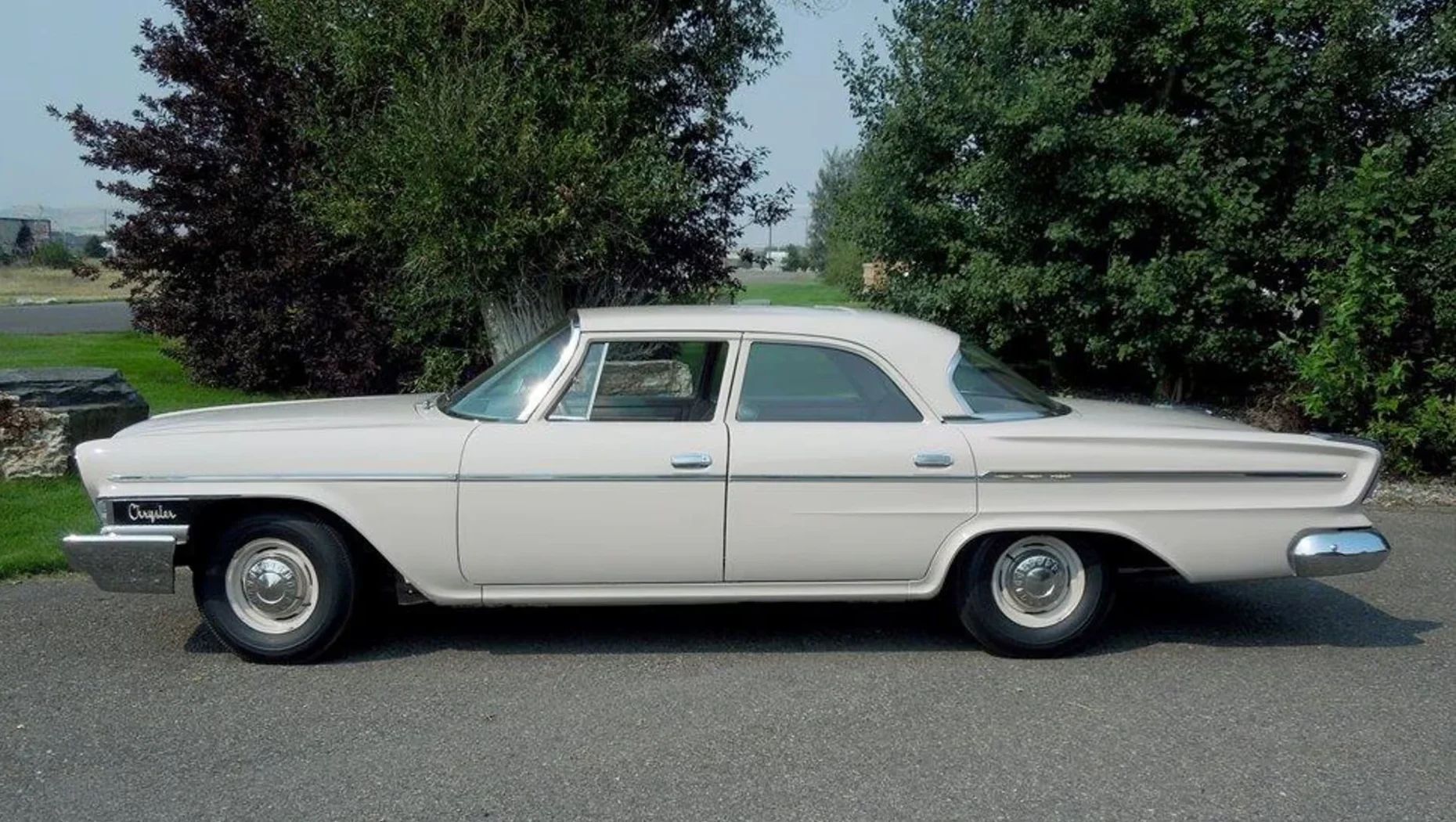 1962 Chrysler Newport 3-Speed Four-Door Sedan: Basic Big Car With An Upscale Badge And Not Much Else 23 Left side view of a 1962 Chrysler Newport sedan, parked outside