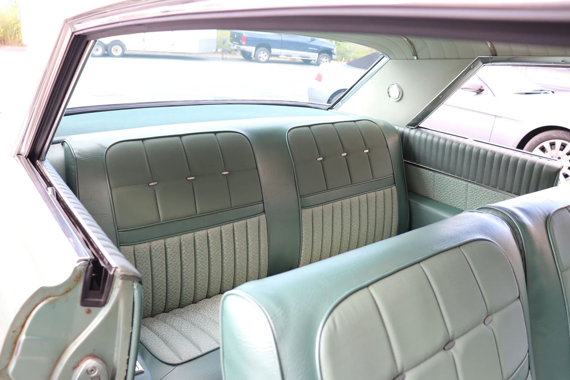 1962 Oldsmobile Ninety-Eight Holiday Coupe: A Sharper-Edged Roof Squares Off The Bubbletop 25 Seats of a 1962 Oldsmobile 98 two-door hardtop, seen through the passenger door looking back
