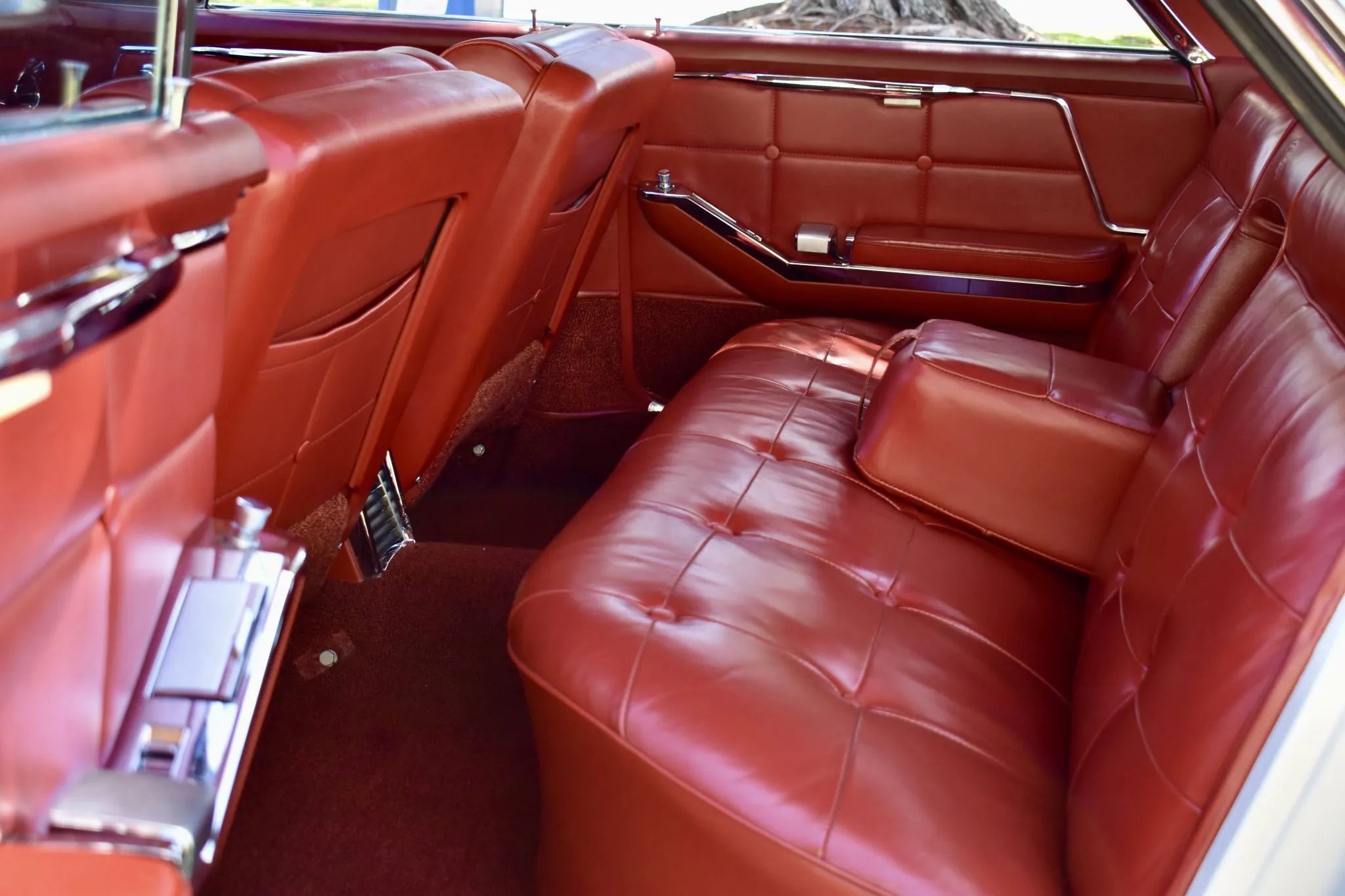 Back seat of a 1963 Cadillac four-door hardtop, seen through the left rear door