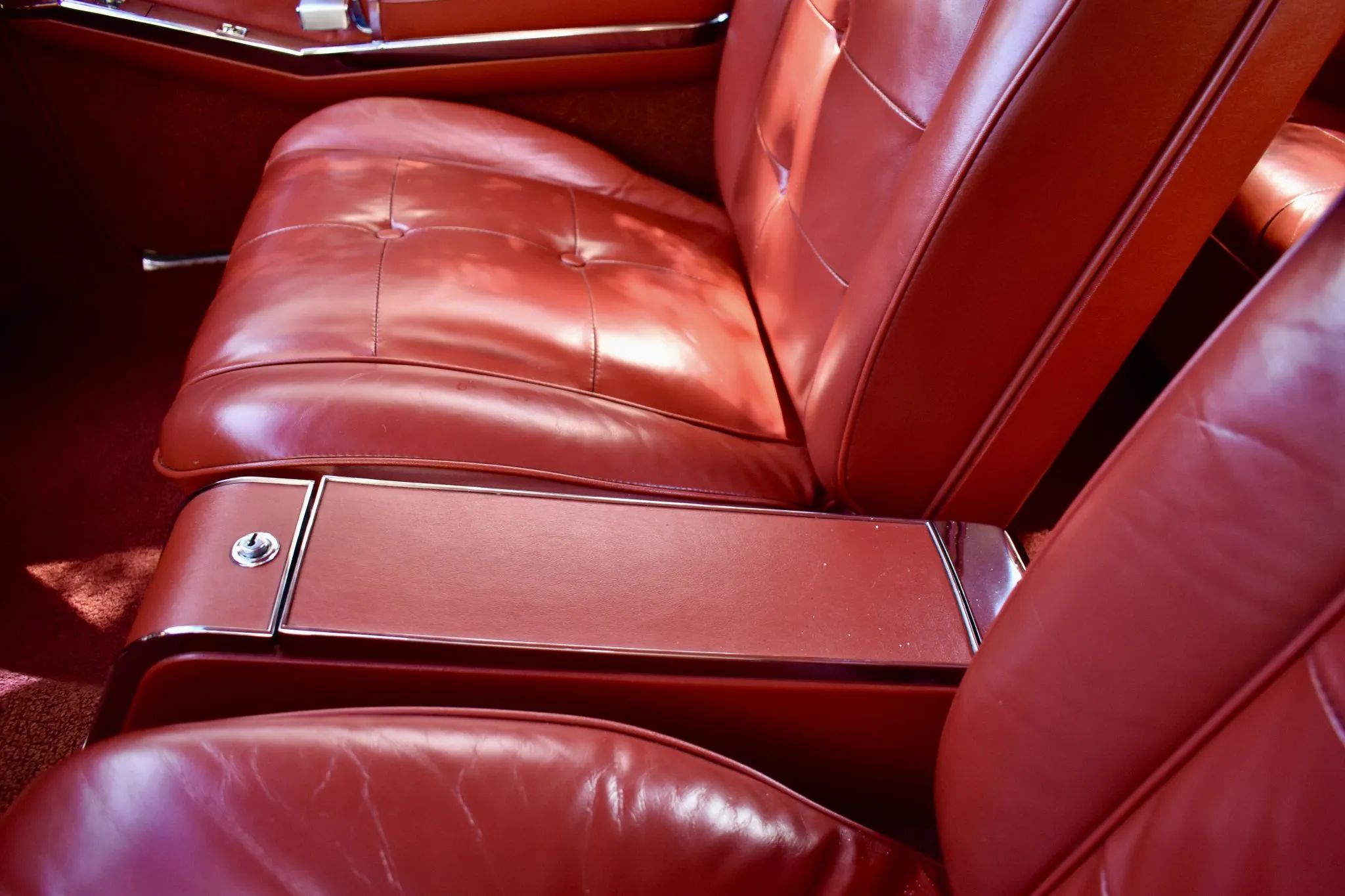 Closeup of the center console in a 1963 Cadillac with bucket seats