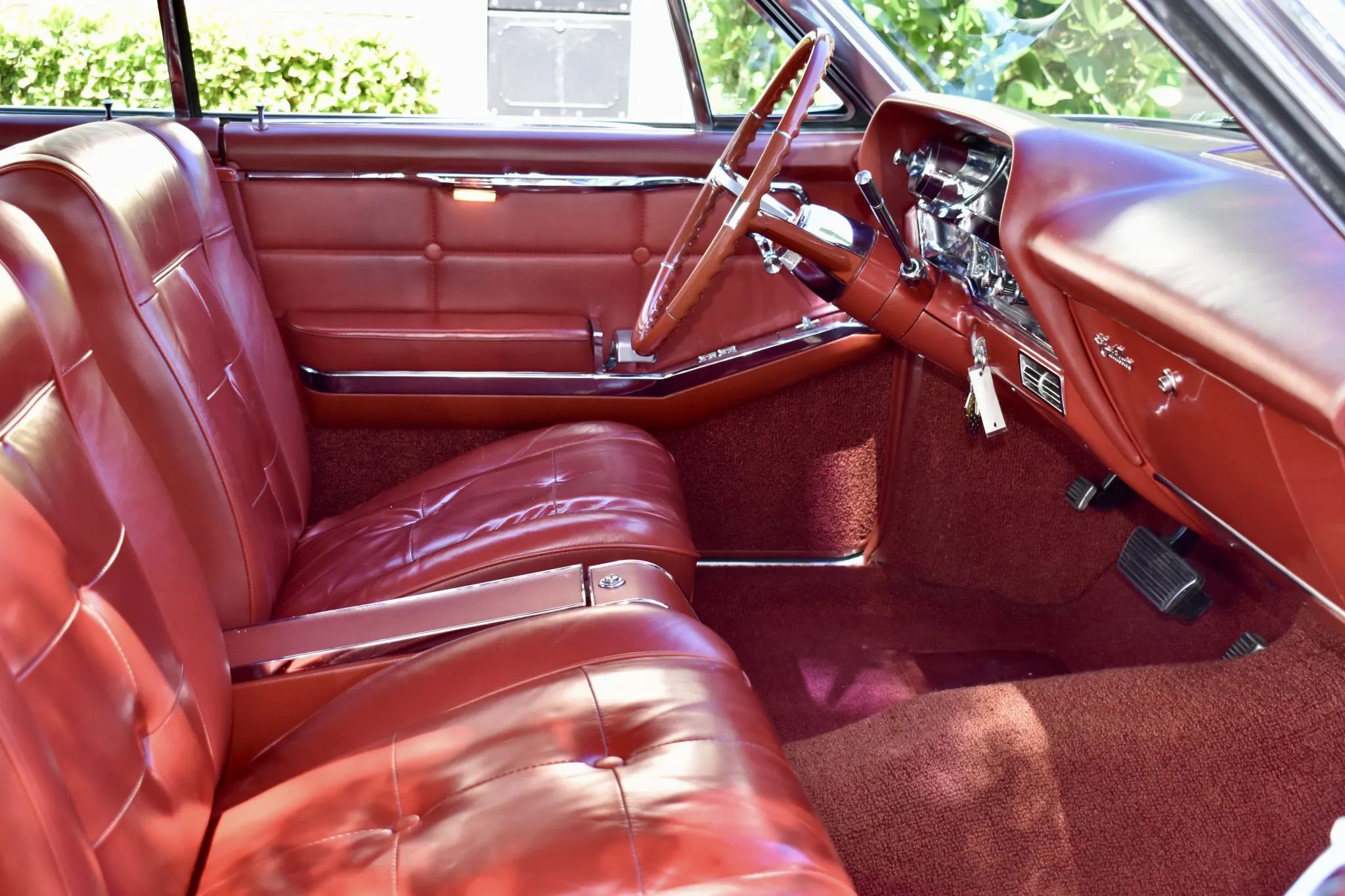 Front seats and dashboard of a 1963 Cadillac with buckets