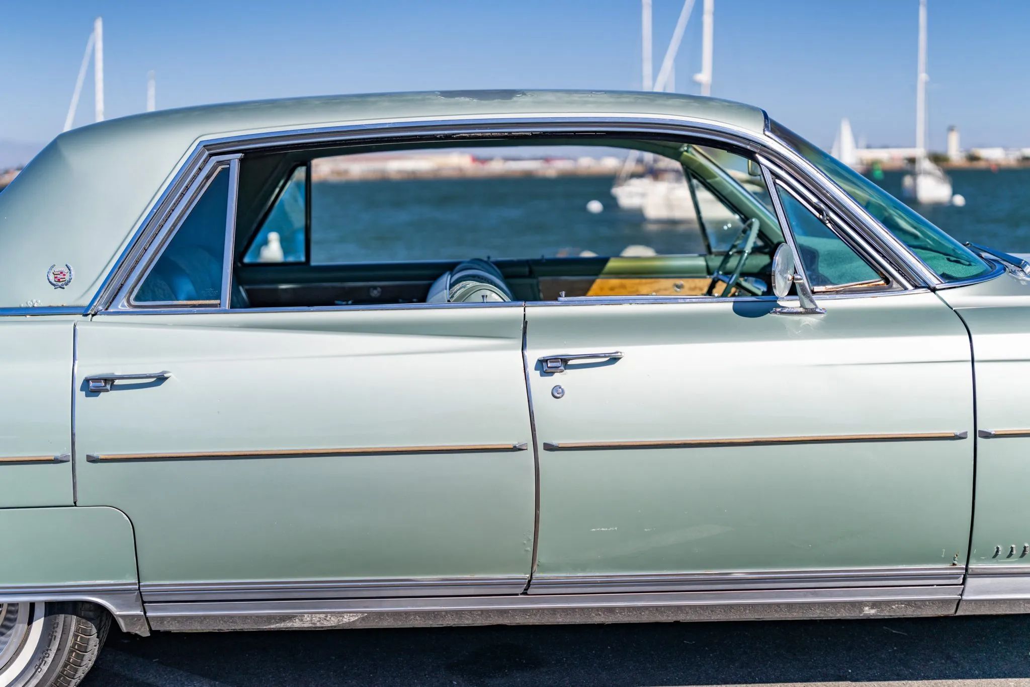Right side windows of a 1964 Cadillac four-door hardtop with all the side windows down
