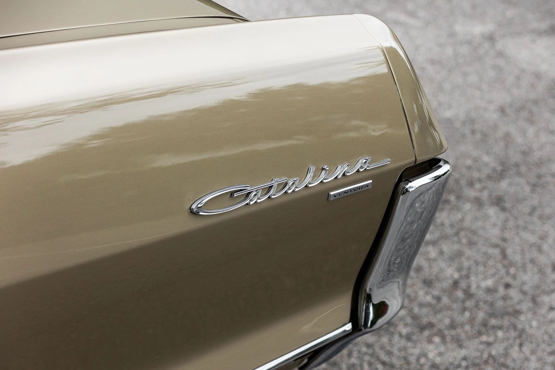 Catalina and Ventura badges on the left rear fender of a 1965 Pontiac