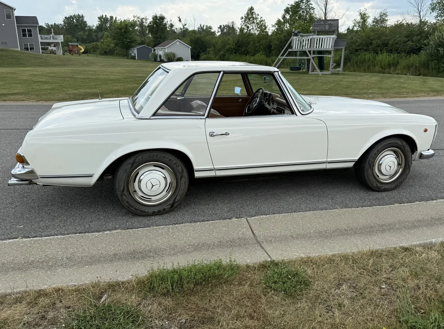 1967 Mercedes-Benz 250SL For Sale: A Well-Maintained Pagoda That Was Imported From Italy 8 Passenger-side view of white 1967 Mercedes-Benz 250SL