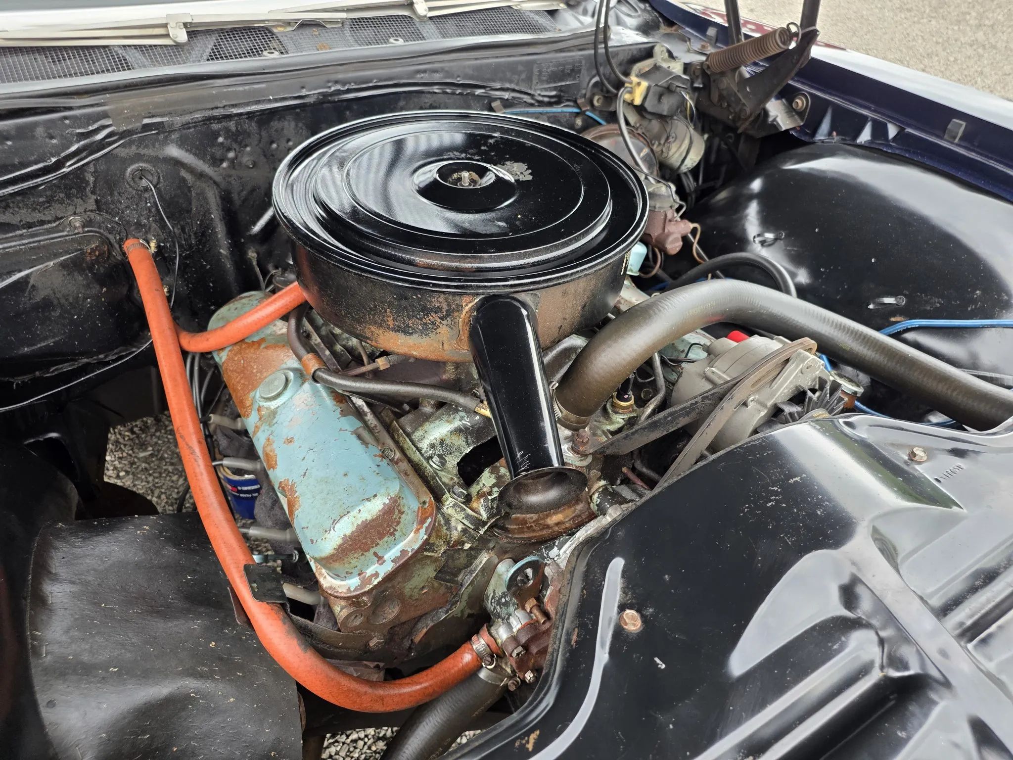 Engine in a 1967 Pontiac; there's rust on the valve covers