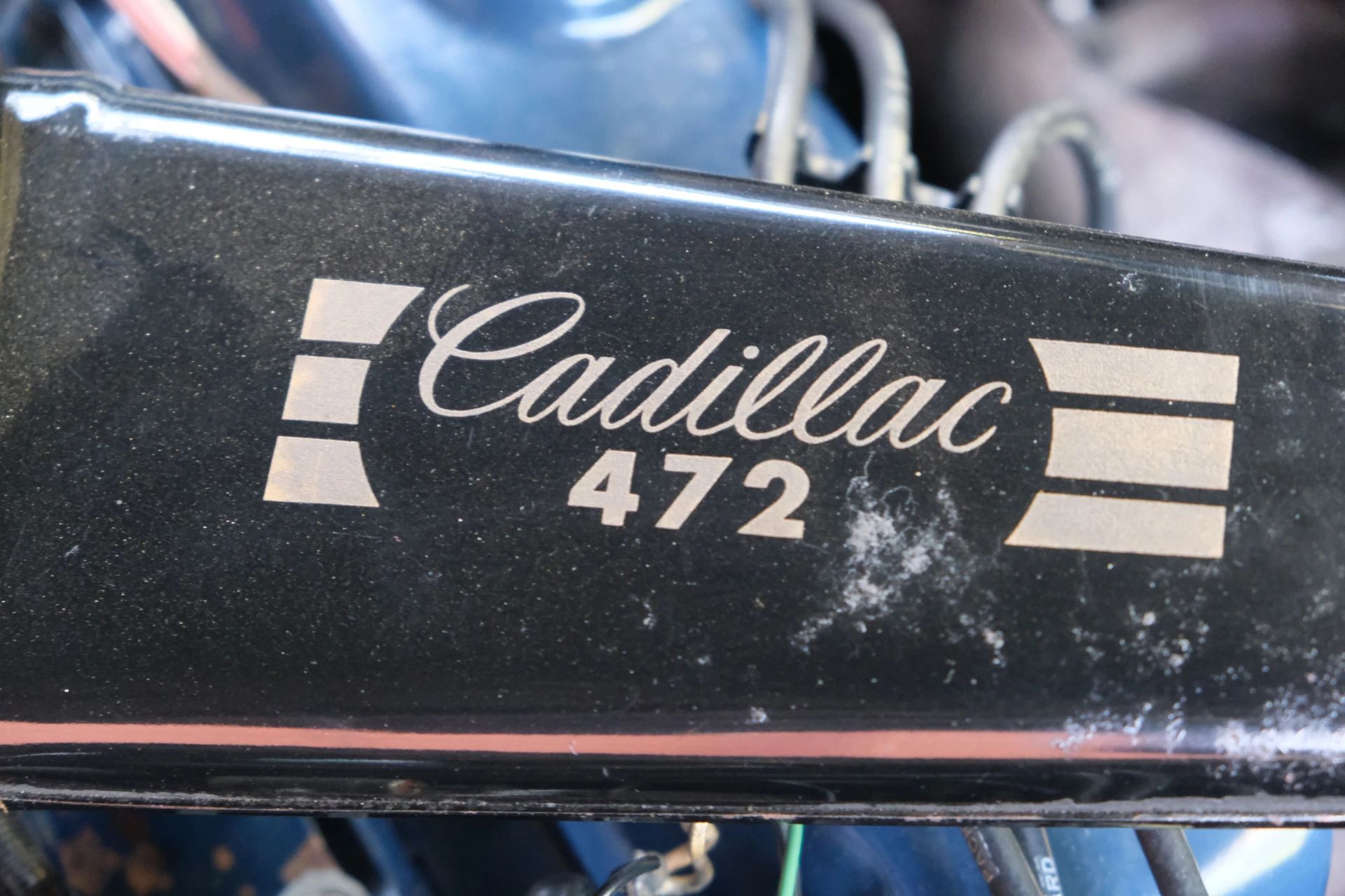 Closeup of the words "Cadillac 472" on the air cleaner of a 1968 Cadillac engine