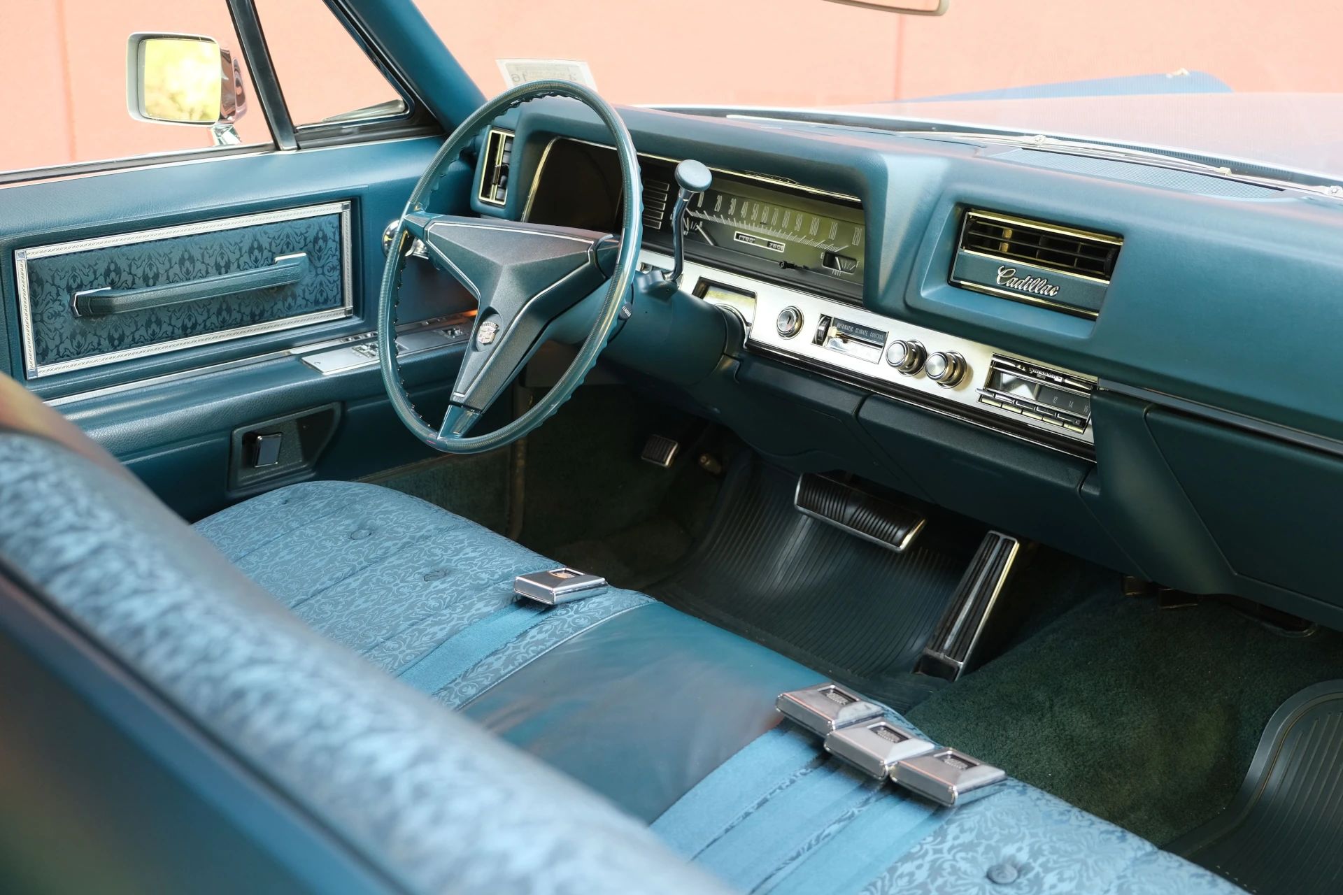 Right side of the dashboard and front seat of a 1968 Cadillac