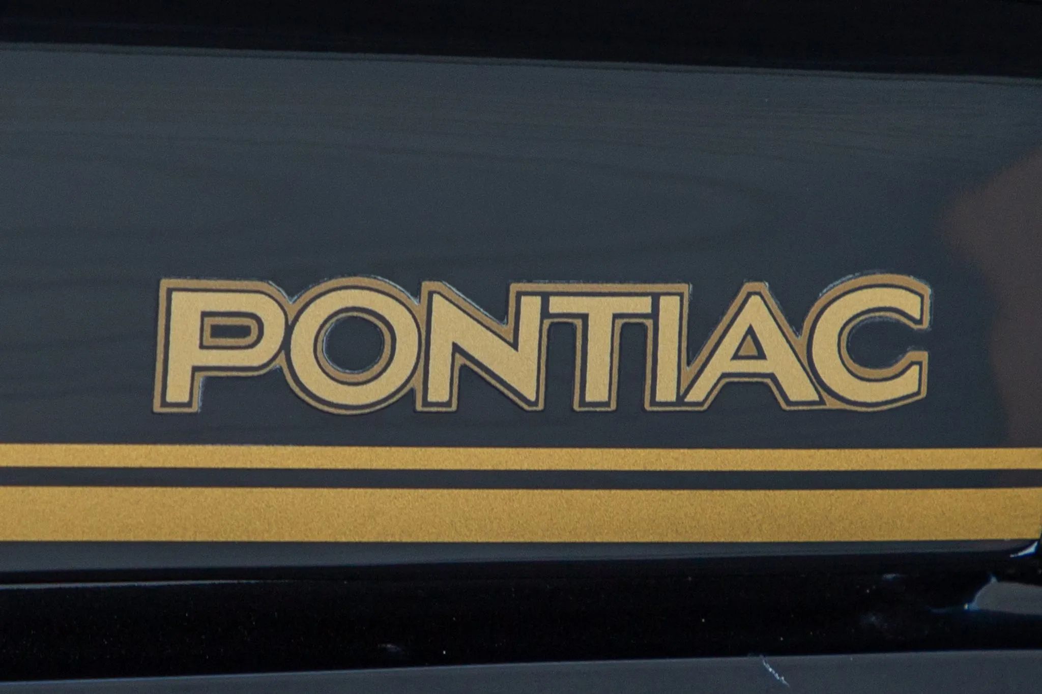 "PONTIAC" decal on a 1977 Pontiac Firebird
