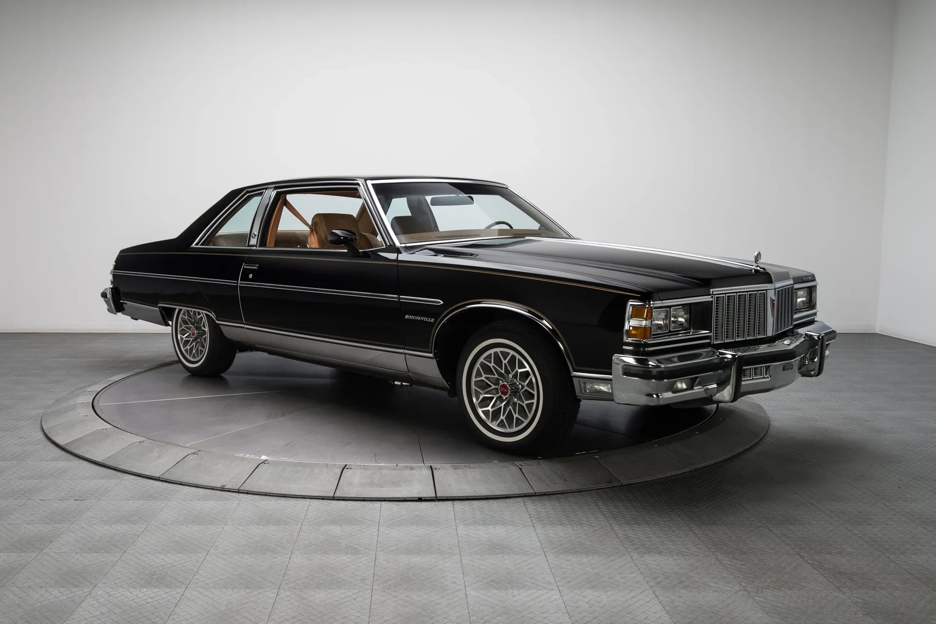 1980 Pontiac Phoenix LJ Coupe: Two Doors, Four Speeds, 32,349 Miles, Zero Credibility 3 Right front 3q view of a 1979 Pontiac Bonneville two-door in an indoor studio space