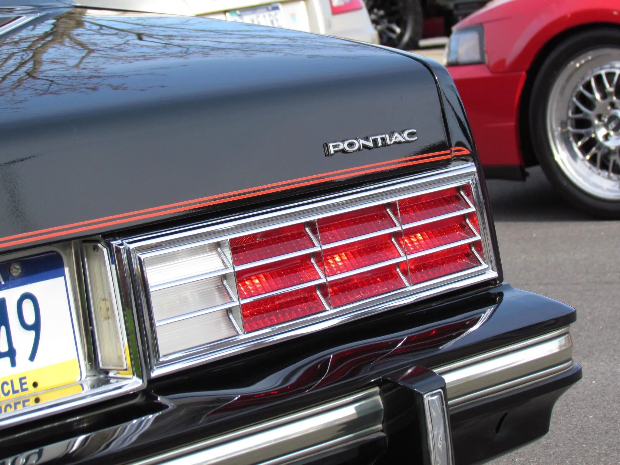 1980 Pontiac Phoenix LJ Coupe: Two Doors, Four Speeds, 32,349 Miles, Zero Credibility 23 Closeup of the right taillight of a 1980 Pontiac Phoenix